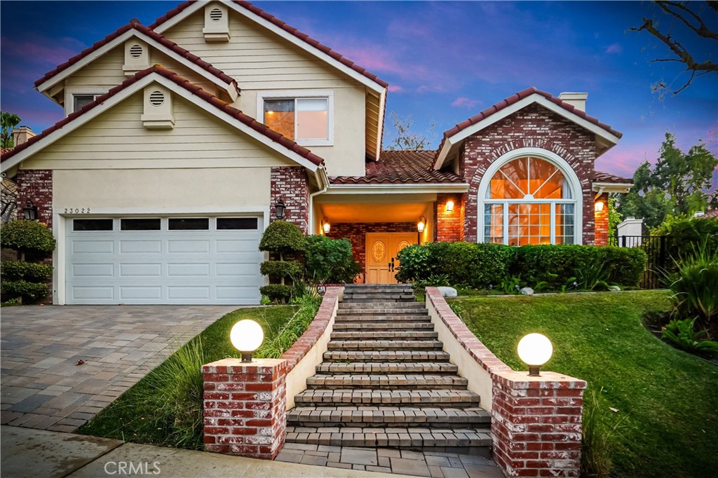 Stunning Furnished Traditional-Style Home in Coveted Calabasas. Welcome to your dream retreat in one of Southern California’s most sought-after neighborhoods. Tucked away on a private cul-de-sac in the prestigious Calabasas community, this beautifully appointed traditional-style residence offers the perfect blend of luxury, comfort, and convenience. Just moments from Calabasas High School and the El Camino Shopping Center, this spacious 5-bedroom, fully furnished home is a rare gem. Step inside to a dramatic double-height living room, bathed in natural light, where an open and flowing floor plan sets the stage for both relaxed living and elegant entertaining. Throughout the home, elegant new flooring enhances the refined ambiance. Enjoy the warmth of three inviting fireplaces and expansive living spaces designed with both style and functionality in mind. The gourmet kitchen is a chef’s delight, featuring a large island with quartz countertops, and opens seamlessly to a cozy family room with fireplace and sliding glass doors that lead to the serene backyard. Upstairs, the luxurious primary suite offers a peaceful escape, complete with dual vanities, a soaking tub, steam shower, and two spacious walk-in closets. Three additional guest bedrooms provide ample comfort and storage. Step outside to a beautifully landscaped private oasis, featuring mature cypress trees, a tranquil stone spa with cascading waterfall, built-in BBQ, and a covered patio—perfect for al fresco dining or relaxing in the California sun. Located within the top-rated Las Virgenes School District and just minutes from the Commons at Calabasas, Lake Calabasas, scenic parks, and upscale dining, this turnkey home offers the ultimate in convenience and lifestyle. Don’t miss this rare opportunity to enjoy luxury living in Calabasas. Available now for short-term lease—fully furnished and move-in ready.