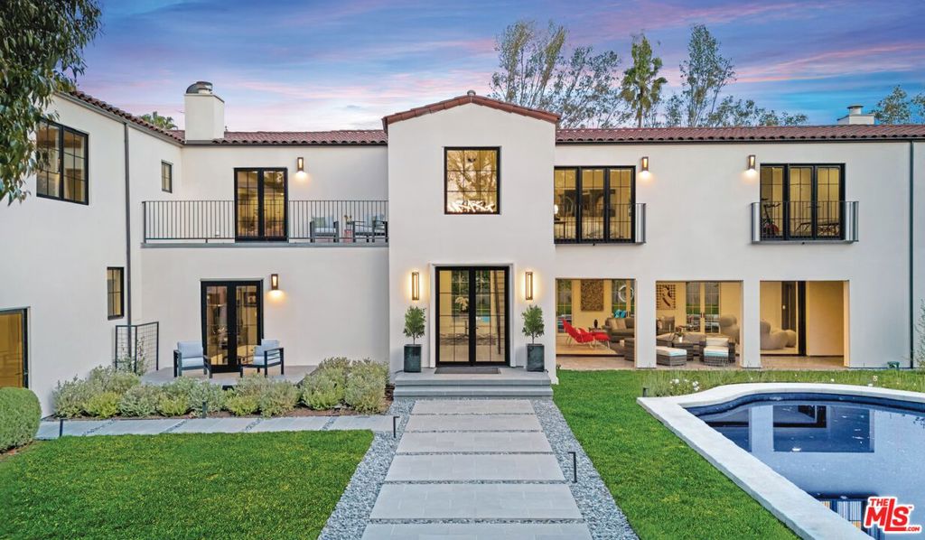 Welcome to El Dorado - a value-enhanced $2 million price change makes this one of lower Bel-Air's most enticing properties and a fabulous opportunity - check neighboring comps and you'll find this is the best buy in the area! Unique, impressive, captivating and completed in 2025 with an overall square footage of approx.13,080 sqft, this stunning Contemporary Mediterranean is a rare fusion of luxury, design, and recreational indulgence offering a dream setting for families, collectors & creatives alike. Tucked behind gates on a flat, apprx. 2/3rd acre 27,000 sqft lot, this exceptional residence was completely rebuilt and blends timeless architecture with vibrant, modern design in pristine, like-new condition. A charming resort-like entrance, lush landscaping, sparkling pool, and secluded garden spa create the ultimate outdoor retreat. Sunlight floods the interior which unfolds across two levels highlighted with dramatic scale and approx. 8,800 sqft of living space. The 5-bedroom, 6.5-bath floorplan includes an inviting living room opening to wraparound verandas, an entertainer's media room with pool table space, formal dining room with terrace access for al fresco dinners, a striking Library for an in-home office and a fabulous family room with adjoining chef's gourmet kitchen that's made to entertain. The second level, with views of the LA skyline, includes 4 upstairs ensuite bedrooms. Serene and spacious, the primary suite with dual baths, dual walk-in closets, exercise room and sitting area is a fabulous retreat to enjoy night and day. Plus, there's an office and den upstairs, and a main-level bedroom suite. But El Dorado's magic lies in its stand-out amenities. A 4,275 sqft remarkably built recreation wing is currently designed as a show-stopping multi-car gallery garage complete with a full-size 19.5ft Carousel USA turntable. For car connoisseurs it offers spectacular space for a cherished collection. For visionaries, it can transform into a state-of-the-art pro-gym, theater or creative studio - there's endless uses for your every need. Out back, there's fun for everyone in the 4,000 sqft sports area that invites every game from pickleball to putting greens to playgrounds. Just imagine your own private park for basketball, football practice, soccer, croquet, lacrosse and it perfect for pets too! For Art lovers there's vast walls and high ceilings for showcasing your favorite pieces. Fully equipped with a 500-bottle wine room, elevator, generator, Control4 smart home system plus an oversized 2-car garage (and 2 additional pkg spots). Conveniently located in Lower Bel Air's iconic East Gate entrance on a private cul-de-sac, just minutes to Beverly Hills, the Sunset Strip, LA's top restaurants and California's dreamy coastline. There is nothing else like it - El Dorado delivers a romantic ambiance, rare amenities, and a treasured LA lifestyle beyond compare, plus its one of the Westside best buys!