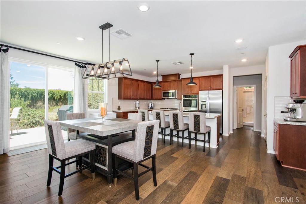 PRICE IMPROVEMENT! Come see this house before it is gone! NO HOA! Model home, newer construction with solar paid, smart home appliances, upgrades galore! Every room in this house is designed with the most discerning buyers in mind. Explore this exquisite Lennar Weatherstone 2022 model home at The Reserve, designed with sophistication and style for memorable living experiences. This home showcases numerous premium upgrades, emphasizing the builder's commitment to quality.
Upon entering, the expansive great room welcomes you with its open-concept design that seamlessly connects to the dining area and a chef-inspired kitchen. The main floor features a bedroom and a versatile flex room that is being used as your own private movie theater, but can be an office or be transformed into a sixth bedroom to suit your needs.
Upstairs, discover a spacious loft offering limitless possibilities, with four bedrooms, two bathrooms, a laundry room and a loft. The luxurious owner's suite provides a serene retreat for ultimate comfort. Enjoy peace of mind with a fully paid-off solar system and all the advantages of a recent build. The landscaping was designed for this model home to take advantage of the weather with gorgeous drought tolerant plants.
Whether you're relaxing or entertaining, this home offers the perfect setting for creating cherished memories. This is the home you have been waiting for!