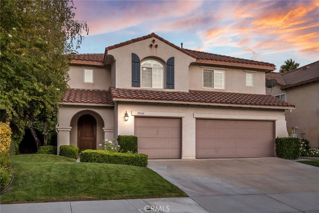 Welcome to this stunning Executive Home, perfectly positioned on a serene cul-de-sac in the highly sought after Upper Stevenson Ranch neighborhood. Walk in and experience nearly 3200 square feet of an open floor plan boasting 4 bedrooms and 2.5 baths. Experience cathedral ceilings, new wide planked vinyl flooring, new baseboards, new inviting interior paint selections, a gorgeous staircase and designer touches throughout. The kitchen has been updated with new tile floors, new quartz counters, freshly painted cabinetry in Pistachio adorned with new hardware, a beautiful new backsplash and a custom display cabinet with extra storage. The family room has a new custom built in media center with lots of storage accented by a cozy fireplace. The dining room is generous in size and is highlighted by a lovely chandelier. The powder bathroom has been updated with a new vanity and fixtures. Upstairs find the Primary Suite encompassing a huge walk in closet, romantic fireplace and a private balcony to enjoy the gorgeous views! The ensuite bath features two vanities, a large soaking tub and a separate walk in shower. The additional 3 bedrooms are all generous in size and have substantial closet space. The hall bath features a double vanity and a separate shower room. Step outside and find an incredibly private backyard with a relaxing covered patio and a huge grassy area for play. Don't miss the modern conveniences of a 3 car garage, recent repipe and upstairs laundry! Close to award winning schools, Richard Rioux Park, shopping and easy access to the freeways!