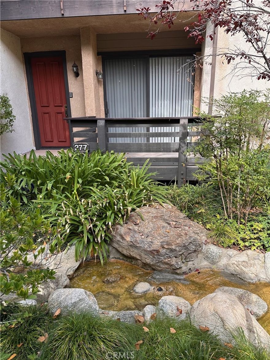 THE DREAM LOCATION, CLEAN AS A WHISTLE, READY TO MOVE INTO, AT A DREAM PRICE in the quiet interior of sought-after Warner Village III across from Warner Center Park with a babbling brook outside your door, is this spacious beauty with high-vaulted ceilings, living room with fireplace and deck, formal dining area or family area, kitchen with breakfast area, 2 spacious master bedroom suites, large bonus room downstairs, and attached two-car garage.  This fabulous townhome complex is known for its lush vegetation, babbling brooks, tennis court, swimming pool and spa and this unit has been lovingly cared for.  Woodland Hills is becoming the entertainment center for Los Angeles and the Valley with the Rams entertainment center slated for the near future, The Village's shopping and restaurants nearby, and Warner Park across the street with its summer concerts.  This is the perfect time to get your home in this place to be.