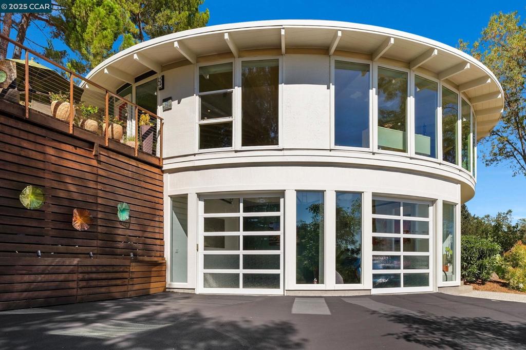 Here’s your opportunity to escape the frenzy of city life into an extraordinary and incomparable home. If you crave uniqueness, fine quality, and the wonders of nature, this may be the jewel you’ve been searching for. Designed by prominent local architect Leon Meyer, this exceptionally appointed residence is an example of the “The Meyer Round” design, which was acclaimed as “the first true round home.” The rooms radiate from the center of the residence (its “core”) and offer an open living environment with walls of floor-to-ceiling windows that provide sunlight and stunning views. A central skylight illuminates the heart of the home offering a rotunda in lieu of a hallway. Ceiling beams radiate from the center of the home, their lines drawing you into the living spaces encircled by photo worthy mountain views. The living, dining & kitchen open floor plan grace the main level of the home, along w/3 bedrooms, 2 full baths and a stepless entry. A spacious bedroom, a 3rd full bathroom and a private entrance into the first level offer flexibility for guests, a home office, art studio & more. Close to downtown and Broadway Plaza yet offering a lifestyle surrounded by nature, this home is for the discerning buyer who values creativity, privacy & postcard views. OPEN for BUYERS SAT/SUN.