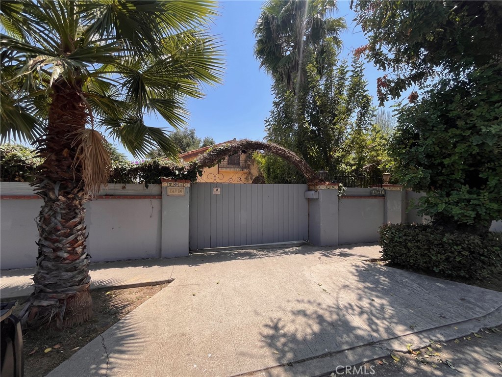 1930s Spanish-Style Home with Great Potential. Calling all contractors and investors! This 1930s Spanish-style home is an absolute must-see. Boasting 5 bedrooms and 4 bathrooms across 3,734 square feet, this property offers significant space and charm. You will find updates throughout, including a modernized kitchen and refreshed bathrooms. The home sits on an extra-large and very private 13,511 square foot lot, complete with a pool—a rare find that adds considerable value, With its generous size, classic architectural style, and substantial lot, this property has great potential.