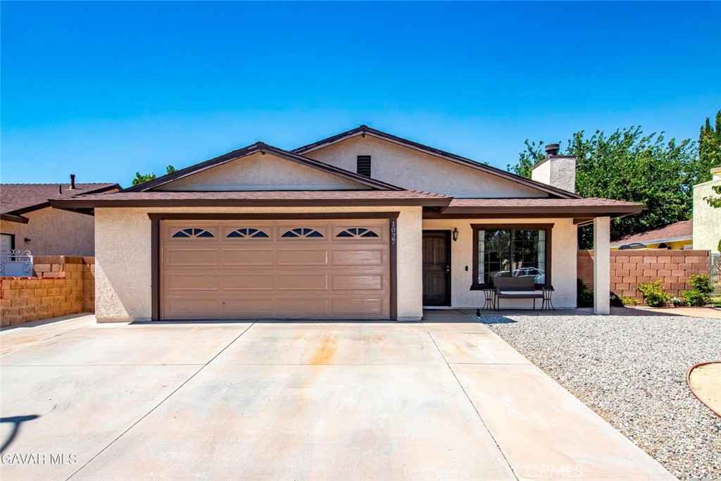 IMMACUATE UPGRADED SINGLE FAMILY READY FOR YOUR FAMILY! This Lovely Home features Attractive Low Water Consumption from landscaping as does the back yard. You enter to the Formal Living room with Cozy Fireplace with Wood Mantle. The Spacious Family Room is adjacent to the Kitchen, perfect for family living. It features a ceiling fan and a slider to the back patio. The Kitchen has been remodeled with Rich Quartz Countertops and Stainless Appliances. There are plenty of cabinets and Lots of Counter Space for the cook in the family. And the breakfast bar is a great gathering place for friends and family. The Large Master Bedroom has a roomy closet and a large clothes/linen closest and a slider to the back patio. The Master Bath has a newly remodeled Oversized Shower with Frameless Thick Glass Doors. Wood look Laminate Wood Flooring in All Bedrooms. Tile Flooring in most of the rest of the house for easy maintenance. Your family will Love the Covered Patio and Mature Trees in the back. There is also a roomy Dog Run or room for your toys on the side! This one won't last!