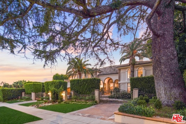 Stunning remodeled Tuscan estate in the prestigious 700 block of North Hillcrest. Private and gated, offering unparalleled attention to detail and luxury. Towering sky-lit foyer opens to grand formal public rooms. Imported Italian limestone, tile, Venetian plaster, and state-of-the-art technology throughout. Gourmet kitchen with top-of-the line commercial appliances, 5 bedrooms en suite upstairs, including master with separate sitting room and his and hers baths. Manicured gardens surround elegant swimmer's pool and adjacent full one bedroom house. An incredible value shown to pre-qualified buyers.