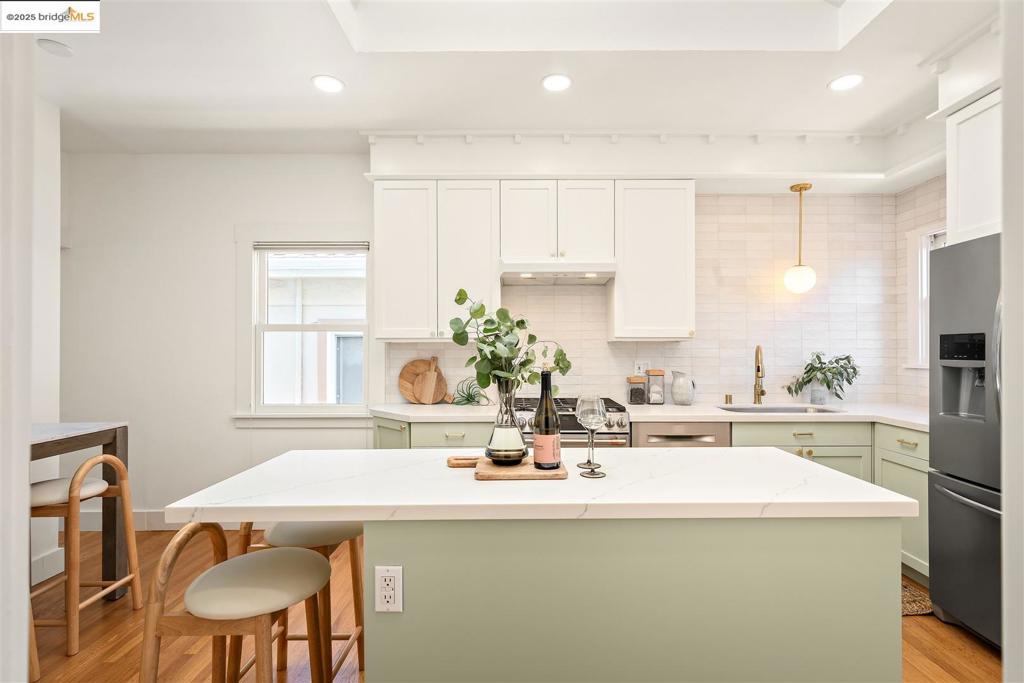 A must see! Design-forward with historical period details, this Rockridge Craftsman has exquisite updates that create a sense of movement, calm, and elegance. From the inviting front porch that asks you to sit and stay awhile, enter into the foyer with natural sophistication as you flow into the graceful formal living room, perched above the street, and separated by historic pocket doors that lead into the dining room with Craftsman details like a box beam ceiling, pretty paneling, and a period mantel around the gas fireplace. A big, bright, design-forward kitchen to cook and gather opens to the delightful backyard. As you explore the 3 bedrooms and 2.5 updated bathrooms, you'll have to decide which bathroom is your favorite . . . maybe the chic mocha pink powder room with black penny tile floor, or the earthy Japanese-inspired one. Don't miss the family room, finished garage, and newer foundation and newer mechanical systems that truly make this home move-in ready. Indoor/outdoor living from the family room into the backyard with a raised veggie bed and large patio for entertaining completes this modern Craftsman. 92 WalkScore® and 85 BikeScore™. Just 3 blocks to BART, Market Hall, and all the popular restaurants and shops on College Ave - welcome to the Rockridge lifestyle.