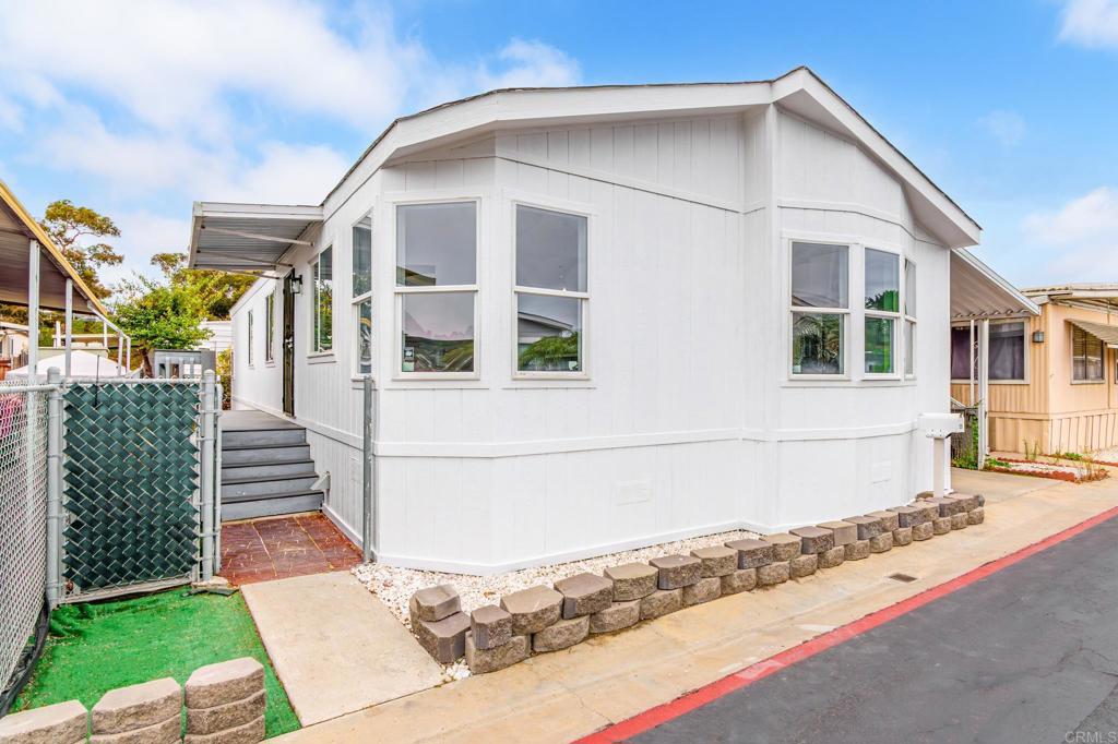 This beautifully remodeled mobile home offers modern comfort just minutes from the beach. Located in an all-ages, rent-controlled community, you’ll enjoy affordable space rent of only $500/month. The home features a complete interior remodel, easy access to the community clubhouse, and a prime location close to coastal living. A rare opportunity to own in a desirable park with low monthly costs! The spacious layout includes a luxurious primary suite, a stylish kitchen with premium fixtures, and a cozy living area perfect for relaxing or entertaining. Enjoy the convenience of beachside living with the added benefits of a welcoming community, nearby amenities, and the tranquility of rent-controlled peace of mind. Don't miss the opportunity to make this stunning, turnkey mobile home your own slice of paradise by the sea.