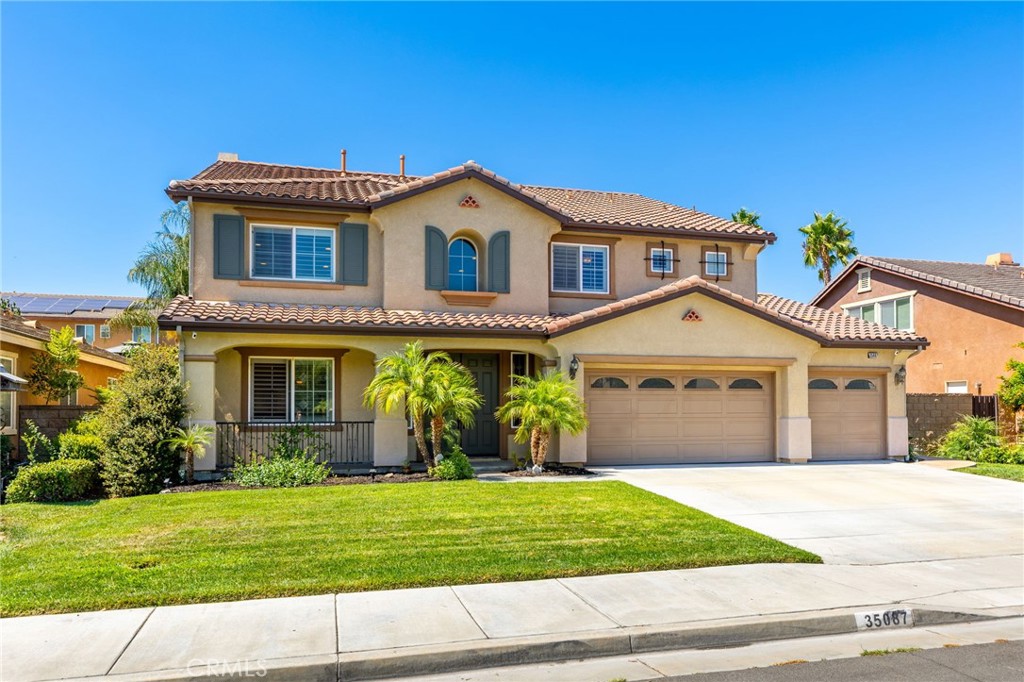 Welcome to this stunning 6 bedroom two-story home, built in 2005, offering 3,829 square feet of living space and an expansive 8,276 square-foot lot. This home's highly functional floor plan is designed for both comfortable daily living and entertaining. Upon entering, you'll be greeted by dramatic vaulted ceilings and a beautiful stained wood staircase. The open-concept layout flows seamlessly from the living and dining rooms into the family room and kitchen. The kitchen is a chef's delight, featuring granite countertops, double ovens, a gas cooktop, and a built-in desk. It also includes a spacious breakfast nook and a bar area, along with a separate room off the kitchen. The main floor offers exceptional versatility with two bedrooms, a full bathroom, and a powder room for guests. The laundry room, also on the first floor, includes a utility sink and built-in cabinets. Upstairs, you'll find a light and bright loft. The primary retreat features an expansive ensuite bathroom with dual sinks, a vanity, a stand-up shower, separate soaking tub, and a large walk-in closet. There are three additional bedrooms upstairs, including one with an ensuite bathroom, and another full bathroom. The private and spacious backyard offers plenty of possibilities to entertain guests, just relax or even room to build your dream pool. The home also features a three-car garage with direct access. Located in a community with walking paths and parks, this home is within the boundaries of award-winning Murrieta schools and is just a short drive to the Temecula Wine Country. All of this comes with a low HOA of approximately $11 per month. Don't miss your chance to own this exceptional property!