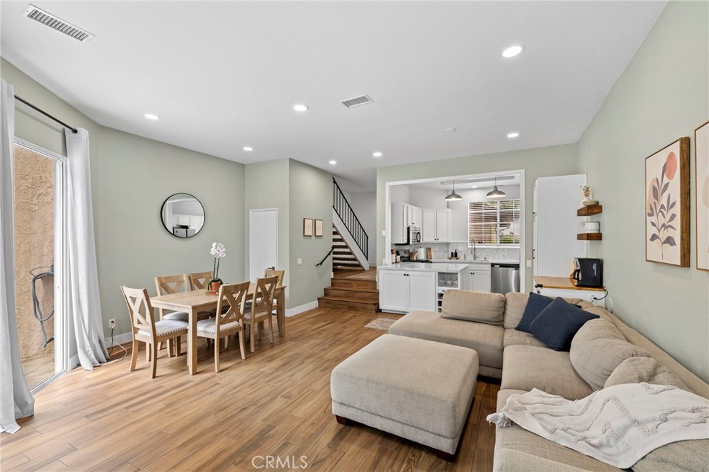 Welcome home! This beautifully renovated 2-bedroom, 2.5-bathroom condominium spans 1,342 square feet and is nestled in the serene Crestline community in Laguna Hills. This home was built in 1985 and has been meticulously updated to blend modern elegance and functional design, offering a truly move-in-ready experience. Upon entry you are greeted with flowing open light-filled living and dining room that adjoins to kitchen that has been fully reimagined by removing a wall to open up the space to the living room to create great room feel. Kitchen features include quartz countertops with matching backsplash, built-in wine rack and wine glass holder, added pantry for extra storage, a charming coffee bar nook, and hot and cold water dispenser integrated with the sink. First level has also been upgraded with wood-look tile flooring, combining durability with warm aesthetics, updated fireplace with a custom mantle and decorative glass rocks accents, and also offers powder room for guests. Enjoy outdoor living with a spacious patio retreat that has been redone with stylish concrete pavers and turf, and awaits you for entertaining family and friends and enjoying those perfect summer BBQ's and the amazing breezes. Second floor is equipped with a laundry area and two well proportioned bedrooms that have been freshly painted for a cohesive, modern palette and each bedroom features updated ensuite bathrooms, with dual sinks and a walk-in closet in the primary suite. Home is complete with a a largely scaled 2-car garage and has access to pool, spa, and clubhouse. Low HOA dues and no Mello-Roos, in addition to being conveniently located near toll roads, shopping, dining, parks, and only minutes from beach cities, This home is a rare gem—modernized with care, filled with thoughtful touches, and ready for you to begin writing its next chapter with you.