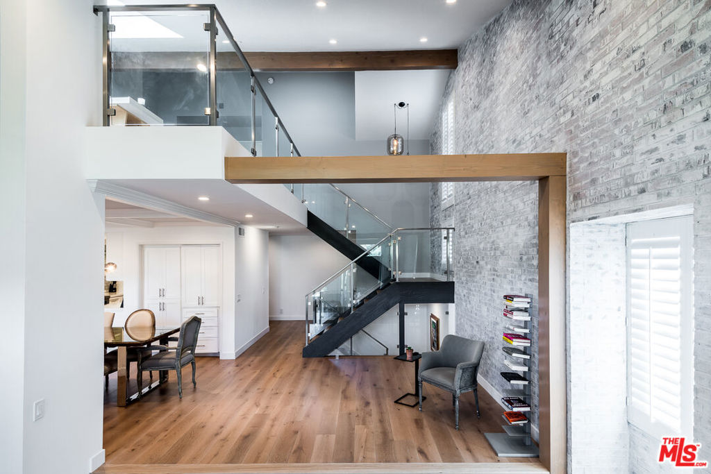 Stunning 3-story end-unit townhome in the Palisades Highlands, offering approximately 2,500 sq ft of thoughtfully upgraded living space. With high ceilings, abundant natural light, and canyon vistas, this residence blends comfort, style, and serenity. The spacious lower-level Primary Suite feels like a private retreat, featuring a decorative fireplace, oversized remodeled spa-like bathroom, custom walk-in closet, and a large connected outdoor terrace. Upstairs, you'll find two additional bedrooms plus a versatile loft. The beautiful kitchen features custom cabinetry and premium appliances. Enjoy indoor-outdoor flow throughout with multiple balconies, plus a private attached 2-car garage with extra storage and laundry. Access to community amenities including a heated pool, spa, sauna, updated gym, and direct access to nearby hiking trails. Important Peace of Mind: This townhome was not damaged in the January 2025 fires, however, it has been thoroughly and professionally cleaned and remediated inside by ATI Restoration, and outside (including the roof, balconies, and patios) by ServPro. Air purifiers with HEPA filters were also run extensively.