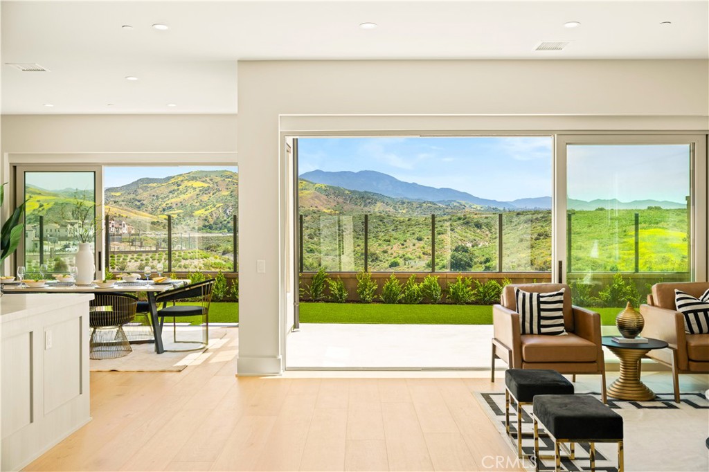 STUNNING panoramic breathtaking mountain and city view Home – Perched on the highest point of the Portola springs, this home offers a perfect balance of nature lifestyle and southern California luxury living. Waking up to the sound of songbirds, enjoying the picturesque scene in the light flooded living room and unwind your night with a glass of wine in the warm embrace of city lights.
This home offers a Tons of upgrades from the builder including Paid off solar panel, luxury engineered wood flooring, gourmet kitchen equipped with high-end Wolf stove and build in Sub-Zero refrigerator, prepare kitchen and designer upgraded cabinet and countertops throughout the home. A bedroom and full bath conveniently located at the first level, ideal for guests or multi-generational living.
Located in top-rated Irvine USD: Loma Ridge ES, Jeffrey Trail MS, and Portola HS and enjoy access to 15+ amenity-rich parks, scenic walking trails, resort-style pools, pickleball and sports courts, and playgrounds—all moments from home. Come to see it and make this dream home yours before it’s gone :)