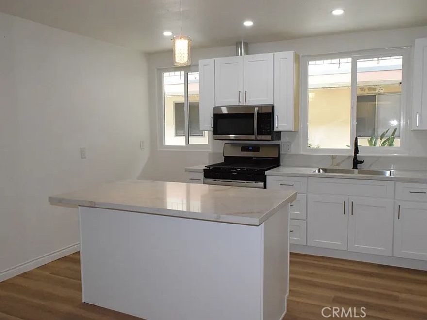 Beautifully newly renovated two bedroom one bathroom in the desirable Downtown district of Santa Ana next to Civic Center. Close to retail, schools and entertainment. Unit has a designer kitchen with large stainless steel sink, new cushion close cabinets, gas stove, microwave, recessed lights, Quartz Counter tops and large middle Island. Unit has new windows and sliding glass windows with A/C, ceiling fans, mirrored bedroom closets and wood floors. Comes with two on-site parking spaces. New designer bathroom with waterfall shower. Water and Sewer included. On-Site Laundry Room. No Pets