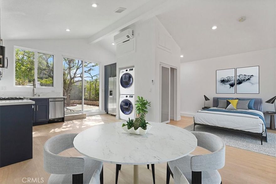 PRIVATE BACKYARD, PRIVATE DRIVEWAY and PRIVATE FRONT ENTRANCE!  Welcome home to this charming newly remodeled detached ADU studio in Northridge's heart. This property is on the side of the main house with a separate entrance tucked away from the street. Ample parking spots are available on the street. An open floor plan with plenty of natural light; stainless steel appliances, quartz countertops, in-unit washer & dryer, fresh paint, energy-efficient windows, newer flooring, newer central A/C and heat, sliding closet with 2 additional storage cabinets. Plenty of natural light pours in through the large windows. The kitchen overlooks the spacious, peaceful private backyard with two large lemon trees—conveniently located near the 101 freeway, Schools, Dining, and Shopping. Don't miss this opportunity!