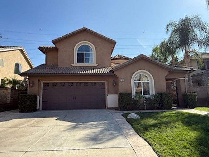 Spectacular views from this beautiful former model home on a cul-de-sac. Large backyard with a pool and spa. As you enter through the gated stamped concrete courtyard into your new home, you are greeted by high ceilings, an elegant wrought iron staircase, a formal living and formal dining room with crown molding, The spacious kitchen opens to the family room and features granite counters w/ full granite backsplash, breakfast bar, white cabinets, double oven, dishwasher and a gas cooktop. The family room opens to the backyard and includes a fireplace, celling fan and built in entertainment center. There are two bedrooms downstairs plus a downstairs bathroom with a shower and upgraded countertop. The second bedroom is an office. Amazing views from the large backyard featuring a newer pool and spa, vast grass area and large covered patio with a tile roof and stamped concrete flooring. Fantastic for entertaining. Upstairs is the grand primary suite with incredible views of the surrounding mountains, hills and canyons. the primary bathroom features dual sinks, a separate shower and tub, and a walk in closet. The other upstairs bedrooms have lighted ceiling fans and share a Jack and Jill bathroom with double sinks and a bathtub, other upgrades include arched doorways throughout, large baseboards, storage shelves in the garage, and an indoor laundry room. So much more to see !