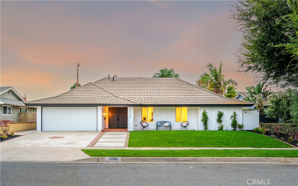 Experience modern elegance and timeless style in this exquisitely remodeled single-story home, offering a turnkey lifestyle in one of the area’s most desirable neighborhoods with award-winning schools. Step inside to premium features that elevate everyday living, beginning with a beautiful entryway that flows into the living room, where a cozy chic fireplace and large windows create a bright and cheerful ambiance. This home boasts four bedrooms and two tastefully renovated bathrooms with modern touches. The primary suite is a true retreat, complete with a new vanity and a walk-in shower featuring a frameless glass door. The guest bathroom offers a custom double vanity, soaking tub, and shower. At the heart of the home, the chef-inspired kitchen shines with elegant Carrara quartz countertops, a tile backsplash, all-new stainless-steel appliances, shaker-style slow-close cabinetry, and a custom peninsula—perfect for cooking and entertaining. Step outside through the new double-paned slider to your resort-style backyard oasis, featuring new landscaping, hardscape, and a spacious deck. Whether for sunny afternoons or starry-night gatherings, this backyard delivers the perfect escape. Additional highlights include a finished two-car garage with new epoxy flooring, new garage motor, new garage door, new HVAC system, permitted windows and sliding door, new PEX plumbing, recessed LED lighting, and GFCIs throughout. Fresh paint, stucco, luxury vinyl plank flooring, and updated bathroom tile add to the move-in-ready appeal. The mainline plumbing has been replaced and includes two cleanouts, the roof has been repaired, and termite clearance has been obtained. Newly installed landscaping, drainage, irrigation, and custom cement steppingstones complete the exterior upgrades. Located near shopping, restaurants, Tri-City Park, and with easy access to the 57 Freeway, this home truly has it all. A true gem in the heart of Placentia—you won’t want to miss it! Day photos will be posted 9/20