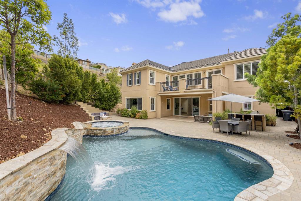 Spectacular San Elijo Hills, Bella Vista pool/spa home located on a HUGE oversized lot in a cul-de-sac! Fantastic open floor plan with soaring ceilings, and tons of windows providing natural light throughout. This highly upgraded home offers a dedicated office/den, bonus loft, downstairs guest room, oversized "mud" room/drop zone and more! Beautiful custom finishes throughout including professional stainless appliances, over-sized island with bar seating. Large glass sliders lead out to a covered loggia/California room perfect for entertaining, large open yard with salt water pool and spa, BBQ island with bar seating, fire pit, and huge side yard ready for anything you can dream up. Expansive primary suite with balcony, large walk in closet and spa inspired bath. Solar for house and pool heating! Bella Vista offers great hiking trails and VERY LOW HOA AND MELLO ROOS!! Top Rated Double Peak School.