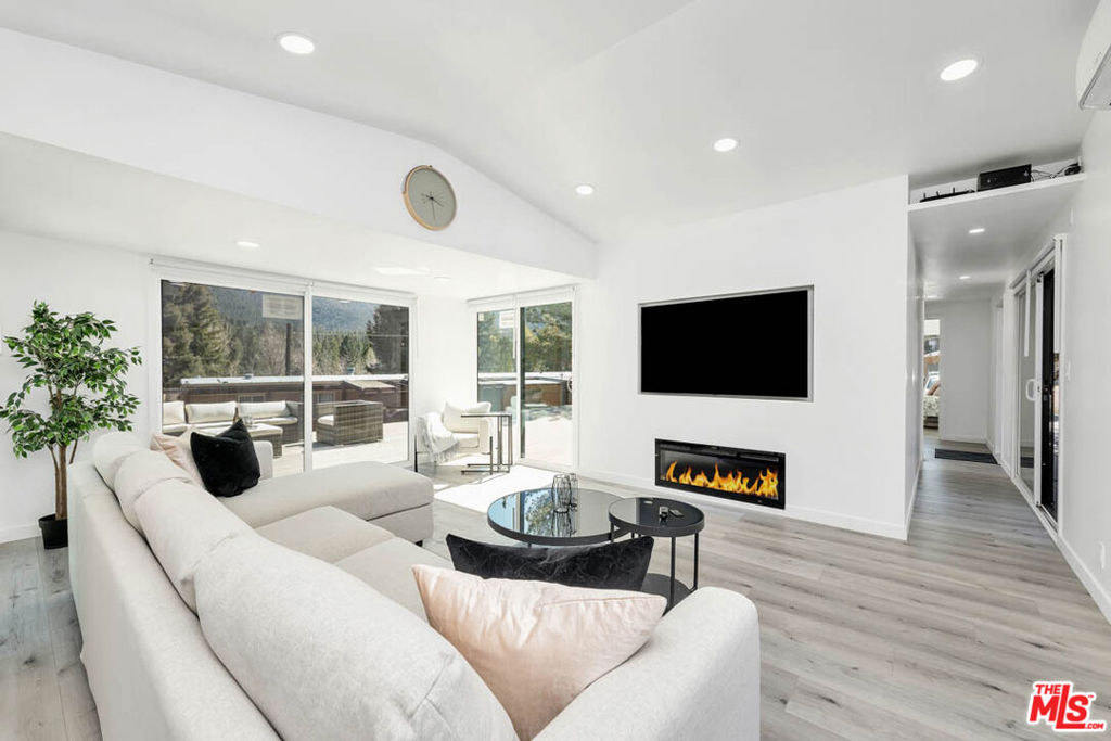 Welcome to your perfect mountain getaway with breathtaking views! This stylish, completely remodeled hillside retreat offers excellent craftsmanship and stunning finishes for a true luxury experience. This gorgeous property showcases open concept floor plan, two bedrooms, and one bath with all rooms opening up to magnificent mountain views! An oversized deck with a spa completes this stunning home and provides everything you need to enjoy a scenic mountain lifestyle or an extraordinary vacation home! Enjoy a soothing hot tub under the stars on a beautiful summer night or during winter wonderland. Panoramic deck with unobstructed views was designed to give you the perfect feel of relaxation and peace while hosting your friends and family gatherings. Top of the line modern look in combination with mountain style finishes include built-in entertainment, electric fireplace for cozy winter evenings, beautiful waterproof laminate flooring throughout, quartz countertops, energy efficient tempered windows and sliding doors, tankless water heater, and more. Property is perfectly located in the gorgeous Pine Mountain Club community that offers the best outdoor experience with pool, tennis courts, golf course, equestrian center, lakes and hiking trails! Walk to your favorite community events, kids playground, shopping, dining and entertainment. Enjoy the outdoor escape experience in mountain magic! This stunning, bold and dynamic, formal and intimate home has it ALL!