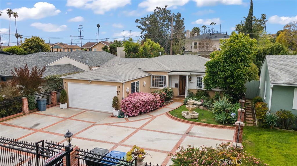 This charming 3 bedroom, 2 bath home at 3569 Kelton Ave is located in the desirable Palms neighborhood of Los Angeles, offering 1,637 sqft of living space on a generous 6,188 sqft lot. The inviting living room features soaring high ceilings and beautiful wood beams, creating a spacious and warm atmosphere. A large parking area in the front with a gate provides ample off-street parking for multiple vehicles, adding convenience and privacy. The versatile converted garage offers extra space for a home office, guest suite, or entertainment area. The backyard is an entertainer’s dream, with a built-in bar, fireplace, and gazebo, perfect for hosting or relaxing outdoors. With easy access to shops, dining, and transportation, this home offers both comfort and convenience in a peaceful yet vibrant location, close to Culver City, West LA, and Venice.
