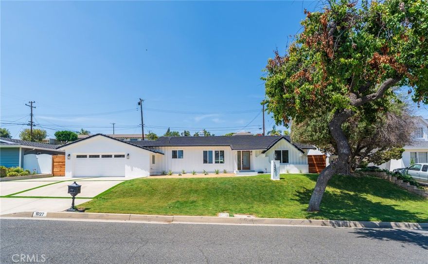 *Resort-style living in the Fullerton Hills!* Welcome to this beautifully renovated single-story, 2-car garage home, where modern design meets luxurious comfort. Located in a highly desirable neighborhood of Raymond Hills in Fullerton, CA. Fresh and clean curb appeal with new landscape and exterior paint. This stunning property boasts a spacious open floor plan with 3 generously sized bedrooms and various premium features that elevate your living experience. 2.5 bathrooms have been tastefully renovated with modern mid-century touches. Step inside through a beautiful custom door and be greeted by the inviting ambiance of the formal living room, enhanced by recessed lighting, new white interior paint, and premium laminate wood flooring throughout the entire home. All new windows and sliding doors. The heart of this home is the chef-inspired kitchen, complete with gleaming quartz countertops, all-new stainless-steel appliances, shaker-style slow-close cabinetry, and a custom kitchen island with a sleek waterfall finish perfect for both cooking and entertaining. There is a chic family room with a tiled fireplace where you can enjoy views of the sparkling swimming pool. Large dual sliding doors open up to your backyard oasis to host all of your special gatherings. With its thoughtful design, premium finishes, and a fantastic layout, this home is the perfect blend of modern living and maximum comfort. Great location with the award-winning Fullerton Joint School District and entertainment destinations. Don't miss this opportunity to make this property your DREAM HOME!