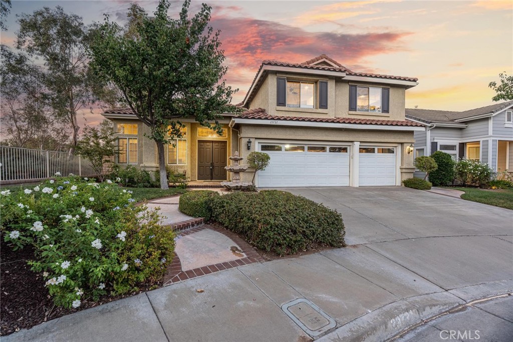 A truly rare find in Valencia’s popular NorthPark Neighborhood, this expanded “Brittany” Model is the largest home in the Windsor tract with an over 600 sqft permitted addition. This pool home is perfectly located and the end of a flat cul-de-sac. 3 bedrooms up plus a large office located on the first level. The home has high ceilings, lots of windows, plenty of natural light and plantation shutters throughout. The expanded kitchen and family room is a dream for your Sous Chef! You will find 2 sinks, 2 dishwashers, 5 burner convection oven, stainless steel appliances and large center kitchen island with granite countertops. The expanded family room features custom window coverings and French doors leading to the yard. Custom wrought iron staircase leads you to the upper level where you will find the primary suite and two more bedrooms. The primary bathroom was remodeled with chocolate marble countertops, chocolate marble floors as well as a walk-in shower with travertine tile and glass. Hallway bathroom has trendy tile floors, gray tile shower and custom vanity. Your private backyard is surrounded by mature trees and features a pool, spa and hardscape area for entertaining. The 3-car garage has epoxy floors and built-in cabinetry. Awesome location close to parks, multiple community pools, schools, dining and shopping all with a low HOA and no Mello Roos. The HOA includes 3 pools, tennis courts, clubhouse and basketball court! A wonderful home in an ideal cul-de-sac location!