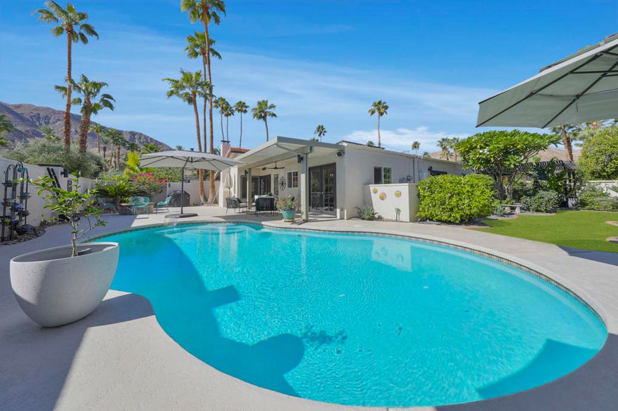 ****Classic 1970's Charmer with Spectacular Mountain Views!!!  Beautifully maintained truly special 3 bedroom, 3 bath home combining timeless architecture with a COMFY modern vibe. WONDERFULLY updated kitchen expansive Living-room, dining-room as well as family-room that offers a Spacious light-filled interior opening seamlessly to an ENTERTAINERS backyard featuring a SPARKLING salt water pool, expansive patio and multiple sitting areas/fire pit to take in those breathtaking MOUNTAIN VIEWS. Designed for effortless indoor/outdoor living, this desert retreat offers style, privacy, and sophistication.  Perfectly situated high up in the Magnesia Falls Cove-where tranquility meets STUNNING scenery. No HOA.