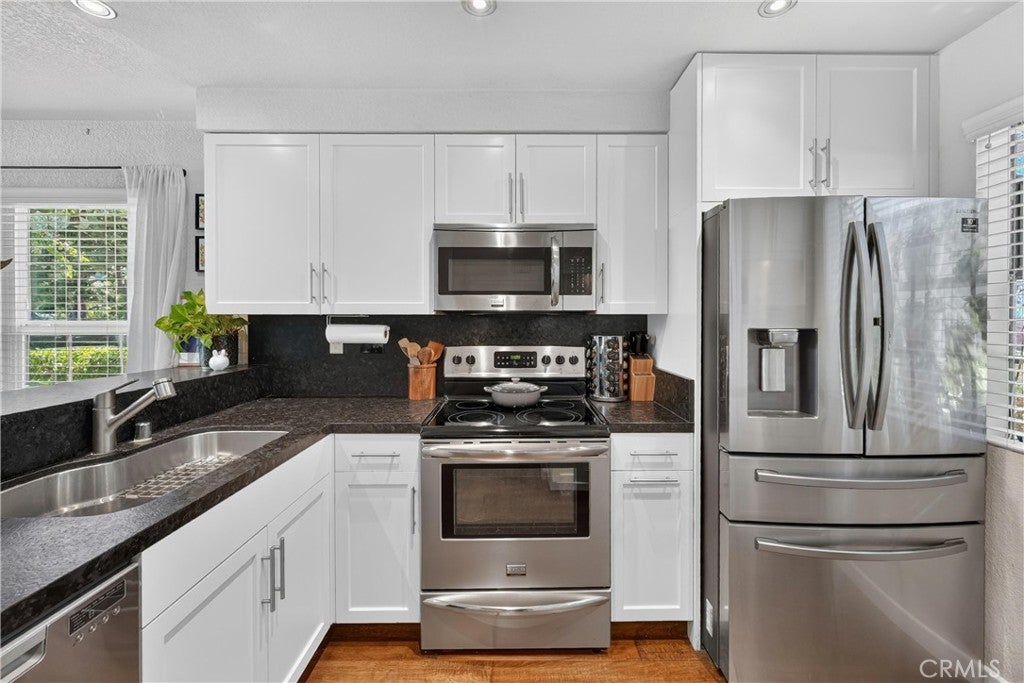 Photo of 26701 Quail Creek Crk #100, Laguna Hills, CA 92656 (MLS # OC26132687)