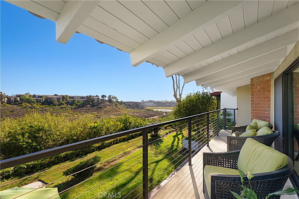 Modern design meets coastal charm in this "front-row" home in The Bluffs Community. You are immediately welcomed by a spacious private patio that is ideal for outdoor dining and entertaining. Step through the front door and take in the breathtaking canyon views that set the tone for this warm contemporary residence. Thoughtfully upgraded, this home features new windows and doors, luxury flooring, Thermador appliances, a whole-house water purification system, CAT5 wiring, insulated ceilings, and an EV charger in the garage. The highly sought-after “E” floor plan showcases an upside-down, open-concept layout that’s perfect for hosting while enjoying the views. The entry level includes the main living areas along with the primary suite. Reconfigured as a two-bedroom (to allow for expanded closet and storage space), this home can easily be converted back into a three-bedroom. With two separate patios and a spacious balcony to enjoy the views, this home embraces the indoor/outdoor lifestyle that defines Southern California. Residents of The Bluffs enjoy community pools, expansive greenbelts, meandering footpaths and nearby access to the Upper Newport Bay Ecological Reserve. This is your opportunity to own a bluff-front property in a prime Newport Beach location, close to top-rated schools, local beaches, Balboa Island, John Wayne Airport and world-class shopping and dining at Fashion Island and South Coast Plaza.