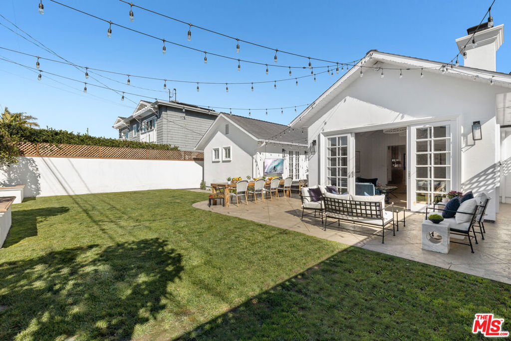 This remodeled 2-bed, 2-bath, charming home includes an additional bonus room and a flexible, open layout perfect for entertaining family & friends. Enter through a custom blue Dutch door into a bright living area that connects to a custom kitchen with a large island and ample seating. A sunlit den with high ceilings and a custom chandeliers opens directly to the backyard, perfect for indoor/outdoor living. The primary suite features built-in closets and a bathroom with a separate water closet. The second bedroom includes built-in storage and a desk. The bonus room is located next to the primary bedroom and can serve as an office, nursery, guest room, or gym. It currently features a built-in Murphy bed for added flexibility. The garage can offer more than parking - it is equipped with built-in closets, dressers, and shelving for smart, usable storage. Situated on a quiet, tree-lined street near Manhattan Beach Middle School and in close proximity to Trader Joe's. Easy access to the 405 and local amenities.