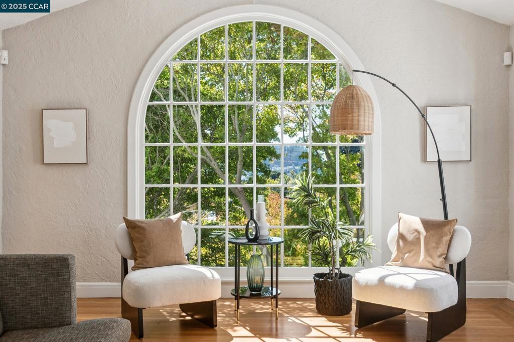 Welcome to 545 Colusa Avenue, a Mediterranean gem in the heart of Berkeley’s coveted Thousand Oaks neighborhood. Situated on an upslope lot, this home is perched well above the street creating a peaceful and retreat-like getaway. Many modern updates are blended with classic charm in this home, which includes a bonus lower level space with its own separate entrance. When you enter the front door, you are drawn to the open concept living room with barrel-vaulted ceilings and gracious multi-light arched windows. The bright remodeled eat-in kitchen features stone counters, beamed ceilings and updated stainless appliances, while hardwood floors create a welcoming feeling throughout. The kitchen opens onto a private patio and a parklike backyard with lush gardens, fruit trees, maples and rock outcroppings. The upstairs features a lovely balcony with outlooks to the Bay Bridge and picturesque skyline views. Across the street from the express commuter bus to The City and just blocks from Solano Avenue’s vibrant shops and Colusa Circle's boutique farmers' market, this home combines serenity and convenience!