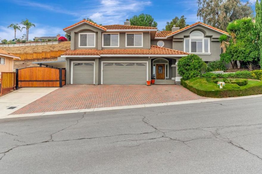 Welcome to this beautiful home located in the gated community of Ridgemark Golf and Country Club. Situated on just over half an acre on a quiet cul-de-sac, this property offers privacy, space, and sweeping views of the mountains and city lights. The main level features 3 spacious bedrooms and 2 full bathrooms, and the living room and kitchen are filled with natural light and vaulted ceilings throughout. The primary bedroom boasts a large en-suite bathroom with a walk-in shower, jetted tub, and plenty of room to relax and unwind. Downstairs youll find a private 1 bedroom, 1 bathroom guest quarters with its own kitchen, living room and separate entrance  perfect for extended family, in-laws, or visitors. The backyard is an entertainers delight with a sparkling solar heated pool, covered outdoor kitchen area, and plenty of space to enjoy with friends and family. This home has a 3-car garage, plenty of driveway parking, and a large storage area under the house. Dont miss the opportunity to live in one of Hollisters most desirable neighborhoods with nearby parks, country club amenities and peaceful surroundings!
