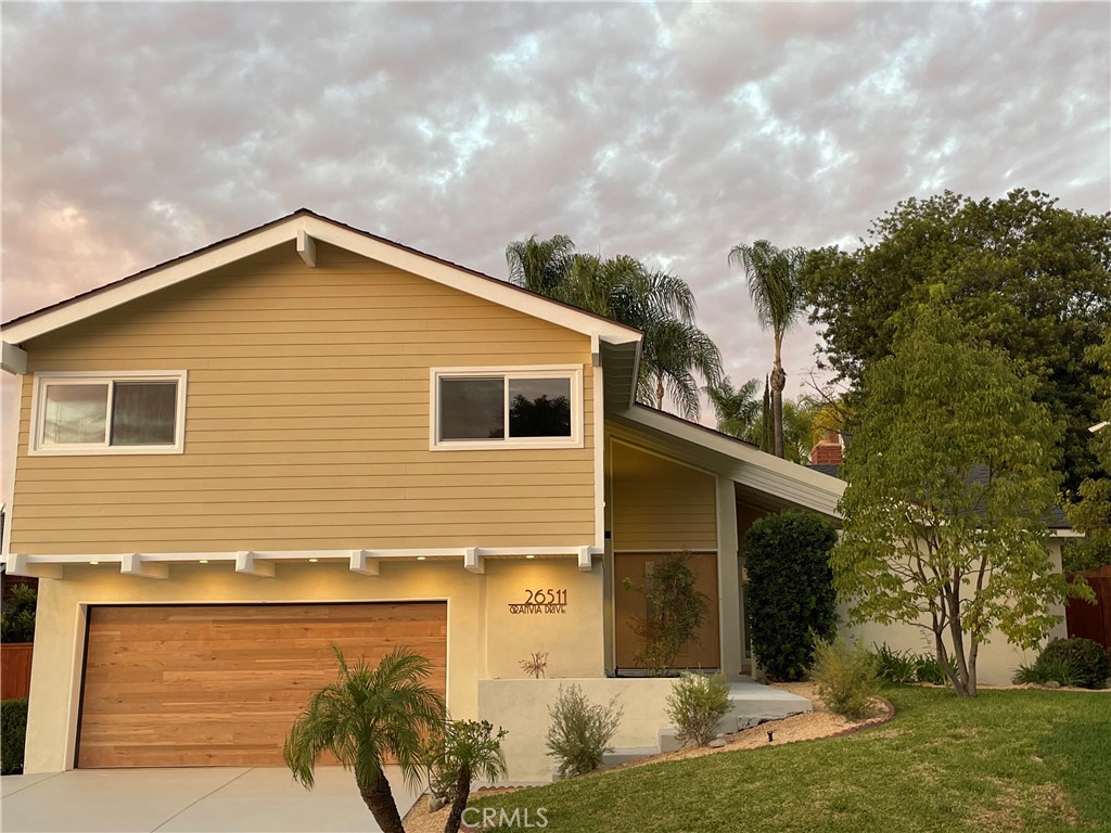 It is an artist's masterpiece for your great taste and appreciation, unlike anything else in beautiful Mission Viejo!!! it is most conveniently located within 3/4-mile walking distance to Mission Viejo High School, middle and elementary schools. Very easy freeway access and shopping facilities. Completely redesigned and renovated from bottom to top that keeps it absolutely unique and much better than most model homes: all around new grading and concrete, new siding and new roof, new windows and doors, new HVAC and electricity system, new high end vinyl flooring throughout, new quartz countertops above natural wood tone cabinets, new garage door and epoxy floor, new closets, new fireplace, new bathrooms with smart toilets, re-piped, carefully crafted landscaping...etc.. Almost 100 recessed lights even cover garage inside and outside. No detail has been ignored for perfection. Great floor plan with high ceiling in living room, one bedroom upstairs has been converted to an open space office. Master bedroom has two closets facing backyard. The front screen wall gives great privacy for living and dining, combined with super large viewfinders, brings stylish Japanese garden experience. Super spacious kitchen is very enjoyable in cooking and watching large backyard where a professional designer spent months to carefully craft a gorgeous landscaping picture with oleanders, palms, bougainvilleas, bananas and figs standing for beautiful outdoor living.