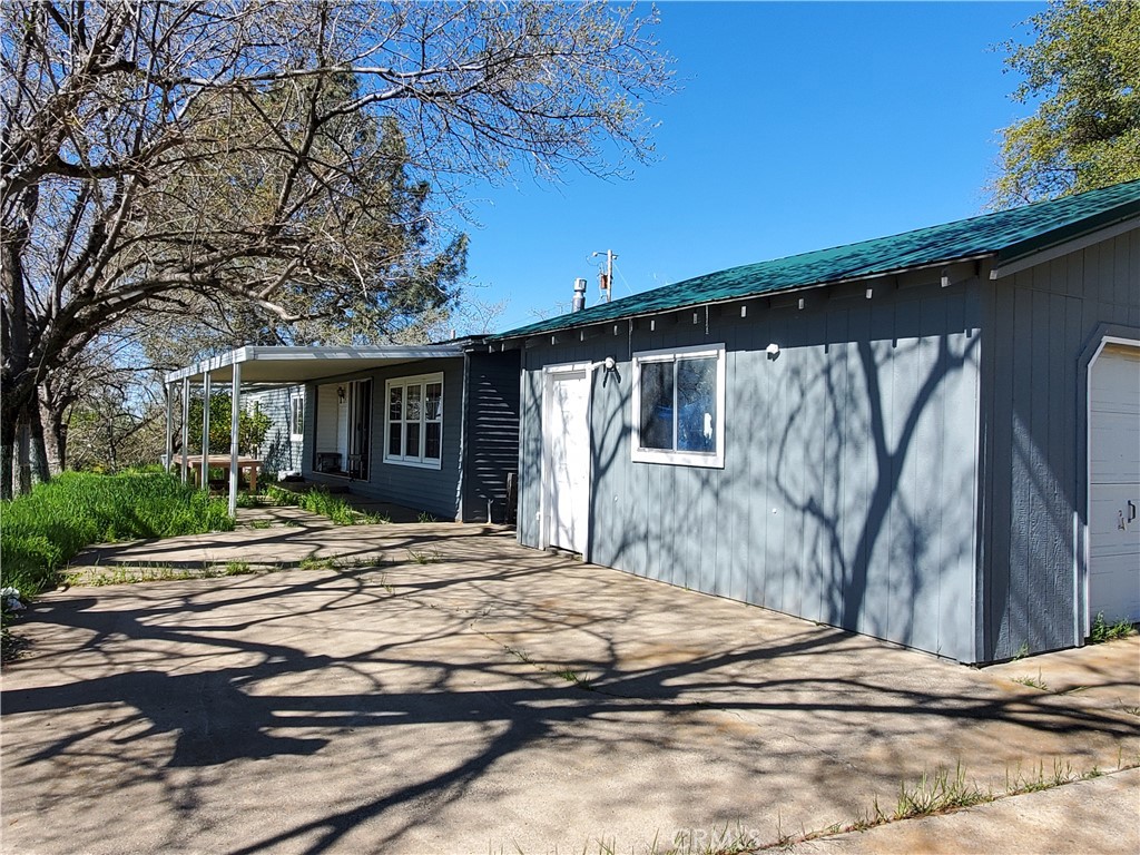 Enjoy breathtaking valley views from the shaded western patio, where gentle summer breezes create the perfect setting to unwind. Picture yourself sipping a margarita under twinkling stars, with city lights sparkling below. This charming 2-bedroom, 2-bath older manufactured home sits on 3.66 acres and features a large bonus room—easily converted into a third bedroom or more! Lemon trees welcome you at the front, while the property includes two wells and a newer 2,500-gallon holding tank. Located at the end of the road for ultimate privacy, this home is a hidden gem waiting for the right buyer Newer Roof & Stunning 180° Views! Don’t miss out—bring all offers!