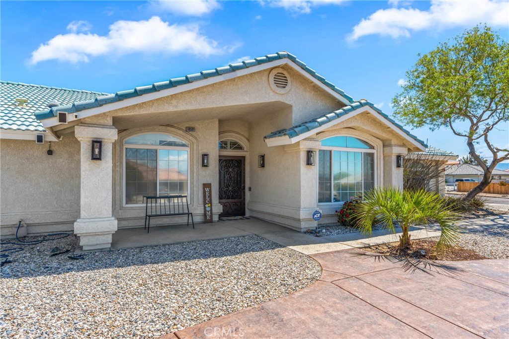 Welcome to this single-story home located in one of Apple Valley’s most desirable neighborhoods, Desert Knolls. Situated on a spacious corner lot, a circular driveway welcomes you and your guests to nearly 2,500 sqft of comfortable living space. Inside, you’ll find tasteful upgrades including laminate flooring and a well-appointed kitchen with granite countertops, breakfast nook, and open access to the family room. This versatile floor plan features generously sized bedrooms, including a large master suite with sliding doors to the backyard, and a large bathroom with a tub, and a separate shower. A secondary bedroom can be used as a 2nd master bedroom with its own private bathroom which is ideal for adult children, guests, or multi-generational living. The office can easily serve as a 4th bedroom. With three full bathrooms in total, there’s space and privacy for everyone. Step outside to a backyard designed for entertaining—complete with a covered patio, stone fireplace, built-in barbecue, pond, and multiple sitting areas to relax and enjoy. The attached 3-car garage provides ample parking, while the detached garage offers excellent potential for an ADU, workshop, or extra storage. Don’t miss your chance to own this exceptional property in Desert Knolls—come see it today!