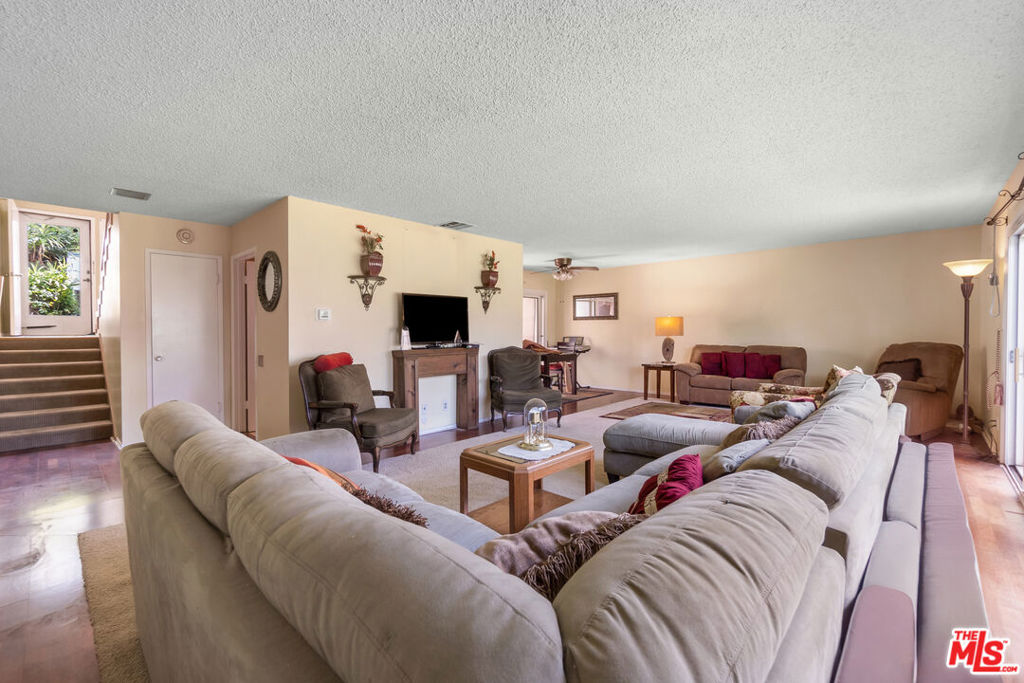 This spacious 2 bedroom 2 1/2 bathroom end unit townhome in the gated Briarwood community offers 1700 sf of living space with only one shared wall. It provides privacy and features one of the largest two bedroom floorplans in the complex. The entry level includes a half bath and laundry room. Downstairs a sun lit living room opens to a grassy courtyard. Also downstairs are the dining nook and kitchen which connect to a private patio perfect for relaxation or a home gym. Upstairs two large bedrooms offer comfort and space. The first bedroom features vaulted ceilings, a walk-in closet, and a balcony with courtyard views. A hallway bathroom separates the first bedroom from the primary suite. The primary suite includes an ensuite bathroom, high ceilings, three closets and balcony access with views of Sofi Stadium. Additional features include a two car carport with storage. Briarwood residents enjoy landscaped grounds, pools, a clubhouse and 24/7 security, which has created a strong community spirit. The location is ideal, close to Sofi Stadium, Kia Forum, Intuit Dome, Cinepolis Luxury Theaters, Hollywood Park and LAX. Don't miss this opportunity to own a home in one of Los Angeles' fastest growing communities. Schedule a showing today!