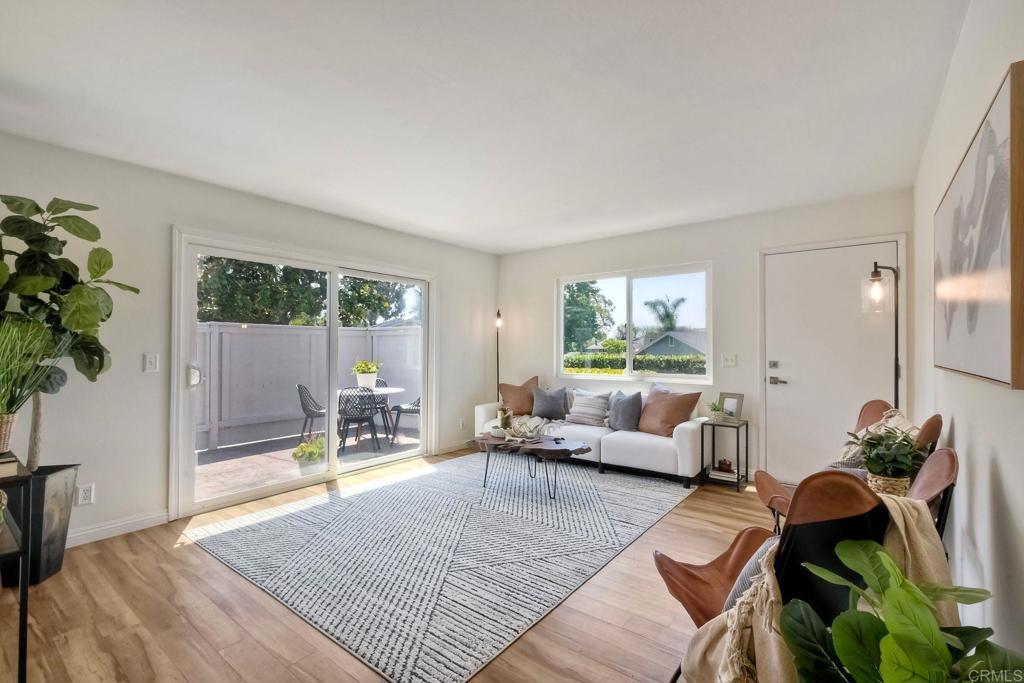 Tucked away on a serene cul-de-sac in the highly sought-after Village Park community, this rare single-story end-unit condo delivers the perfect blend of comfort, privacy, and laid-back coastal living. With 3 bedrooms/2 full baths and only one shared wall, no neighbors above, and sweeping open-space views, it’s a true hidden gem. Inside, natural light pours into a spacious floor plan featuring a primary suite with full bath, two versatile bedrooms ideal for kids, guests, an office, or nursery, and a second full bath. Enjoy two private patios/courtyards — perfect for morning coffee, alfresco dining, gardening or a little California sunshine. The fresh, neutral design makes it easy to bring your own style to life. Village Park offers low HOA fees, resort-style amenities: a sparkling pool, tennis/pickleball courts, playground, and clubhouse — all just minutes from top-rated schools, local boutiques, popular dining spots and only three miles from the world-famous beaches of Encinitas. Bonus: The carport can be converted into a one-car garage with HOA approval, adding flexibility and value. Whether you’re a first-time buyer, growing family, downsizing, or simply ready to embrace the relaxed SoCal lifestyle, this home is ready to welcome you.
