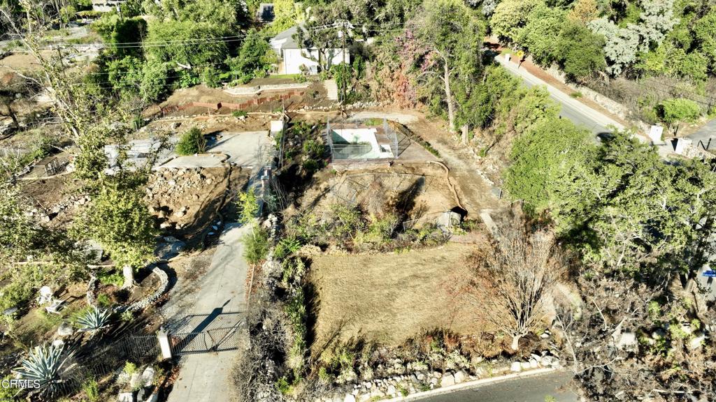 Discover a remarkable opportunity in Altadena at 2629 Boulder Road. Situated on what was once one of Altadena's most beautiful streets, this expansive 13,736 square foot lot with 80 feet of frontage offers you the chance to rebuild and reimagine. Previously home to a charming 2,601 square foot English-style residence dating back to 1925, alongside a Guest House, this property is primed for you to design and create your dream living space in a coveted location. Enjoy the added benefit of being close to the Altadena Country Club and Golf Course, along with popular local spots like Prime Pizza, Millie's, and Lavender & Honey. This is an opportunity not to be missed!