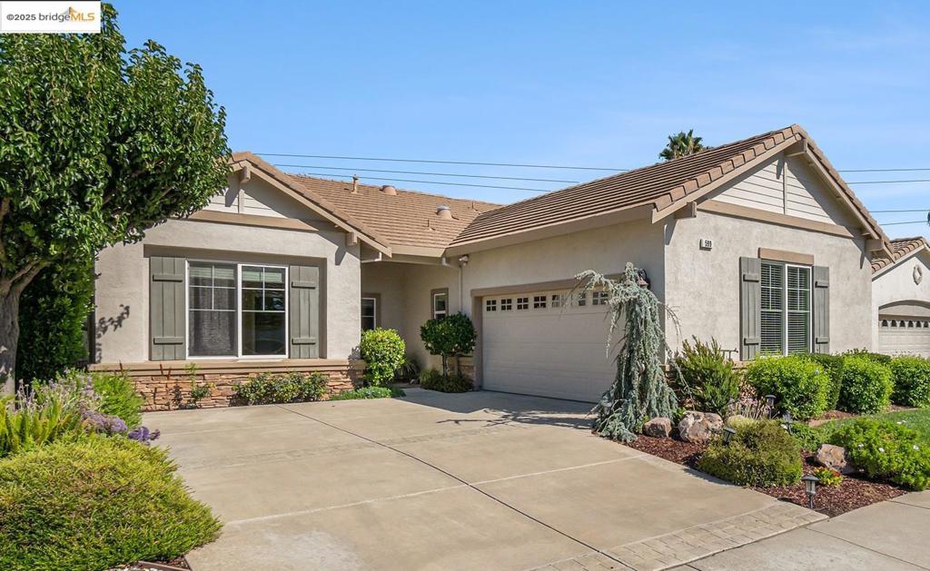 Welcome to your dream home, perfectly situated on the golf course and designed with comfort in mind. This popular open-space floor plan is bathed in natural light from numerous skylights, creating a bright and inviting atmosphere throughout. Enjoy the great room with its fireplace. The kitchen features a generous island with a breakfast bar and a walk-in pantry. The spacious primary bedroom boasts a bay window and a large walk-in closet. A sizable office offers the perfect space for remote work or hobbies, while the interior laundry room comes complete with a washer, dryer, sink, and ample room for storage or a craft area. Step outside to enjoy the expanded covered patio with drop-down shades, perfect for relaxing and taking in the scenic golf course views. This home offers the perfect blend of functionality and lifestyle. Come join this wonderful 55+ community with all its amenities: lodge, ballroom, gym, game rooms, library, tennis & pickle ball courts, bocce courts and our own 3 acre park with picnic tables and BBQs and activities too numerous to mention! Life is good here!