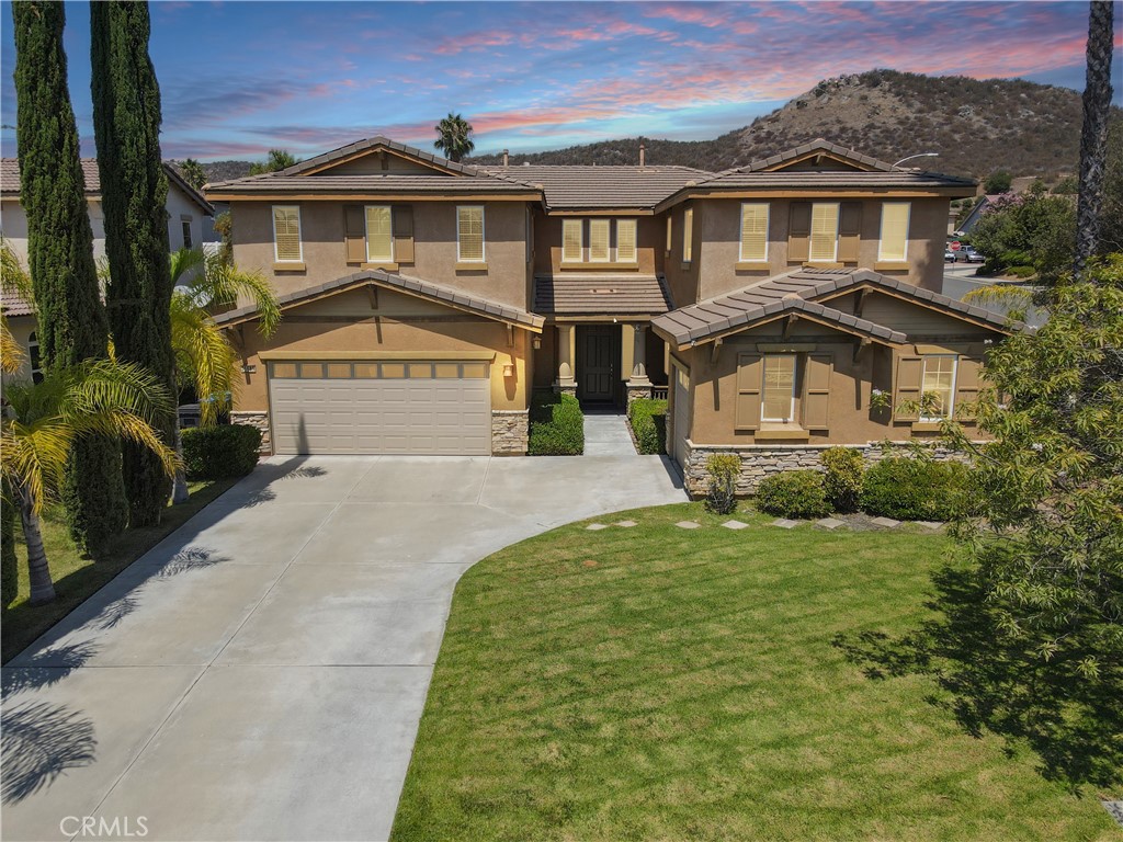Welcome to 36689 Clove Currant Lane, tucked away on a quiet cul-de-sac in the highly desirable Murrieta Oaks community. This spacious residence offers the perfect blend of comfort, style, and convenience—featuring 5 bedrooms, 4 bathrooms, and a versatile floor plan designed for modern living AND PAID OFF SOLAR with a full price offer. Your new backyard might just be big enough for a pickleball court!
Property Highlights:
Expansive Lot: One of the largest in the neighborhood, providing space for outdoor living, gardening, or future pool potential. Paid-Off Solar: Energy efficiency and savings built right in. Main Floor Suite: Convenient downstairs bedroom, full bathroom, and laundry—ideal for guests, in-laws, or multi-generational living. Custom Shutters: Elegance and privacy throughout the entire home. 3-Car Garage: Ample parking and storage.
Bedrooms & Living Spaces:
Upstairs Loft: Perfect for a game room, office, or second family room. Expansive Primary Suite: Includes a retreat/flex room, oversized walk-in closet, and spa-style ensuite bathroom. Jack & Jill Setup: Two upstairs bedrooms connected by a shared bathroom.
Prime Location:
Murrieta Oaks is loved for its family-friendly atmosphere, quiet streets, and convenient location. You’ll be minutes from top-rated Murrieta schools, shopping centers, restaurants, and outdoor recreation. Enjoy quick access to the 215 and 15 freeways, making commutes simple to nearby Temecula, Riverside, or San Diego.
Why You’ll Love It:
With its oversized lot, solar savings, flexible living spaces, and cul-de-sac setting, this home is the complete package for anyone looking to settle in one of Murrieta’s most desirable neighborhoods.
