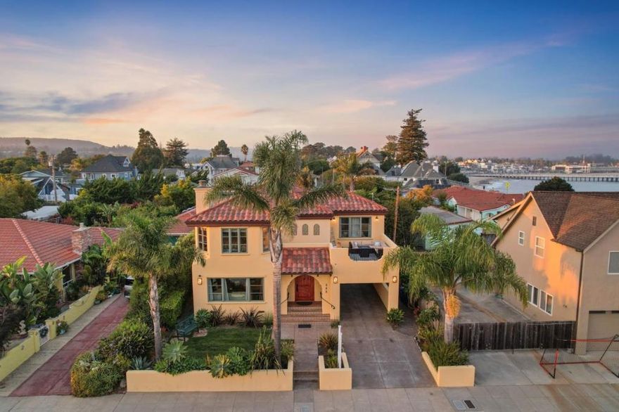 Experience the Santa Cruz lifestyle at 116 Monterey St, steps from iconic West Cliff Drive. This delightful 3 bed/3 bath Mediterranean home offers stunning ocean views, the soothing sound of waves, and fresh sea air. A permitted 1 bed/1 bath ADU at 118 Monterey St is ideal for guests or rental income. For those who love to cook, a spacious Chef's Kitchen with Wolf Range and large kitchen island will feed your family for years to come. Surf, SUP, or swim at Cowell's, and then come home to soak in your jetted spa tub in the luxurious primary bathroom.  Cool fog and ocean breezes create a refreshing vibe, while sunrises grace the front windows and sunsets glow from the balcony. Relax in the hot tub under starry skies or gather around the backyard fire pit. The ADU, a successful vacation rental, attracts wonderful guests and generates income with it's own private balcony atop a 2-car Mechanic's Garage. There's even a built-in vaccuum to get the sand out of your car! Steps from Steamer Lane and race starts like Wharf to Wharf, this home is a coastal gem. Enjoy music, wine tasting, or a meal at the historic Santa Cruz Wharf. Monarch butterflies flutter year-round, and the nearby community garden is great for birdwatching. Embrace this coastal retreat, and schedule a tour today!