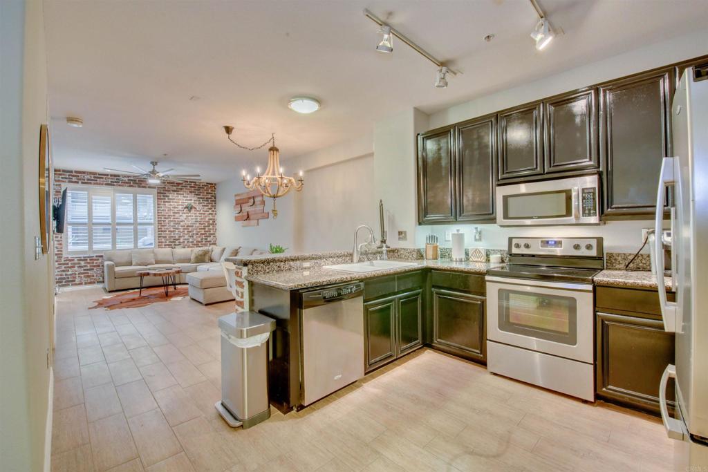 One of only four unique Residences in Crown Bay with two entrances. Residence #211 boasts two bedrooms, two baths, upgraded granite counters in kitchen, porcelain tile throughout, SS appliances, spacious walk-in master closet, and 2 pkg. Equipment: Dryer, Fire Sprinklers, Garage Door Opener, Range/Oven. One entrance from the spacious patio off the beautifully adorned Courtyard and another at the north side of the building. One flight up from the fitness room, with no need for the elevator, makes a perfect setting for pets, kids, the elderly, and more. Located just steps to the Gaslamp, Petco Park, Convention Center, and more. Neighborhoods: Marina District Complex.