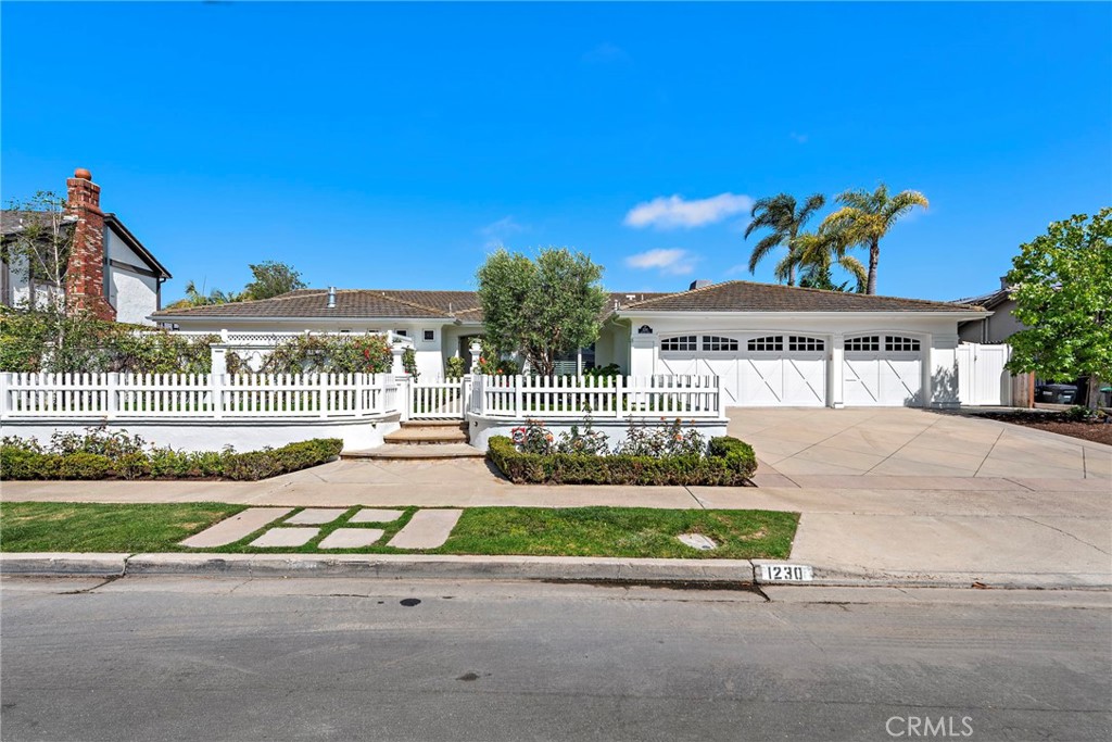 Located in the heart of Dover Shores, this beautifully updated 5-bedroom, 3-bath single-level home offers the perfect blend of elegance, comfort, and family functionality. With thoughtful renovations, the home is move-in ready and designed for effortless coastal living. A spacious open layout features hardwood floors, recessed lighting, and a bright, welcoming atmosphere with lots of natural light. The gourmet kitchen flows seamlessly into formal dining and family areas—ideal for entertaining. A second bonus room sits just off the main family room and offers a perfect space for a kids’ play area, media room, or game zone.
The private primary suite includes a spa-like bath, walk-in closet, and access to a serene outdoor patio—perfect for a peaceful morning coffee, yoga flow, or personal retreat. Two bedrooms share a Jack & Jill bath, while the fourth bedroom is a flexible space—perfect for kids, guests, a private studio, or cozy retreat. The fifth bedroom serves well as a home office with direct backyard access. A third full bath connects conveniently to the backyard for outdoor use.
Step outside to your own private oasis with a sparkling pool, spa, fire pit lounge, putting green, and expansive patio entertaining space—all surrounded by mature landscaping. Whether hosting summer gatherings or relaxing in the evening, the backyard is designed for year-round enjoyment. Set on a oversized lot with a three-car garage, this home is in award-winning Mariners Elementary, Ensign Intermediate, and Newport Harbor High. Enjoy scenic Back Bay trails, convenient access to Fashion Island and world-class beaches, and walkable proximity to the Newport Aquatic Center and 17th Street’s renowned dining and shopping.
This is more than a home, it’s a lifestyle.