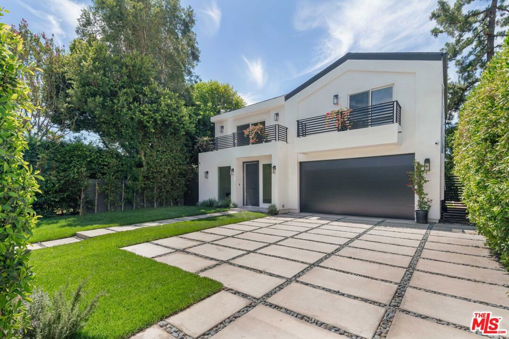 Traditional New Build in Prime Studio City. Welcome to this stunning newly constructed traditional home, thoughtfully designed with timeless elegance and modern comfort. Nestled on a serene tree-lined street in coveted Studio City, this residence blends classic architectural details with today's most desired amenities.Inside, you'll find an open and inviting floor plan filled with natural light, featuring wide-plank hardwood floors, custom millwork, and designer finishes throughout. The gourmet chef's kitchen boasts bespoke countertops, professional-grade appliances, and seamless flow into the spacious family room with fireplace and built-ins. French doors open to a beautifully landscaped backyard, perfect for entertaining with room for a sparkling pool, spa, and covered patio.The home offers generous living space with 3 bedrooms (including a luxurious primary suite with spa-like bath, walk-in closet, and private balcony), multiple en-suite bathrooms. Just moments from top-rated schools, Ventura Boulevard dining and shopping, and easy canyon access to the Westside, this property perfectly combines traditional charm with contemporary luxury living in Studio City.