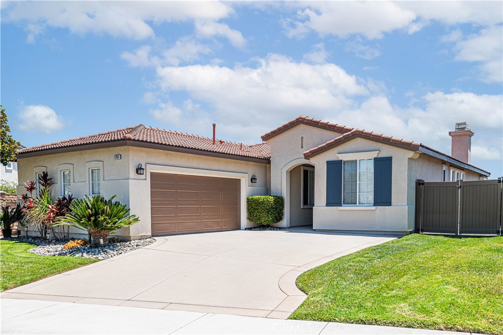 Welcome to this meticulously maintained former model home nestled in the highly sought-after Copper Canyon community. Situated on an oversized cul-de-sac lot, this pristine 4-bedroom residence also features a large bonus room/office. Step inside to soaring 11-foot ceilings and a bright, open floor plan. The remodeled kitchen boasts granite countertops, custom tile backsplash, and newer stainless steel appliances, flowing seamlessly into the spacious family room with a cozy fireplace. The expansive primary suite offers a remodeled en suite bath, while the generous secondary bedrooms feature ample closet space. Pride of ownership throughout with newer HVAC, whole house water filtration system, EV charging system, new electrical panel. Additional features include, designer paint, gorgeous tile "hardwood" floors and newer carpet. Enjoy the beautifully landscaped backyard with sweeping mountain and hillside views, firepit, sparkling hot tub, new redwood deck with alumawood pergola, and new vinyl fencing. There’s also potential for small camper or RV storage. Conveniently located near shopping, freeway access, and top-rated schools—this home truly has it all!