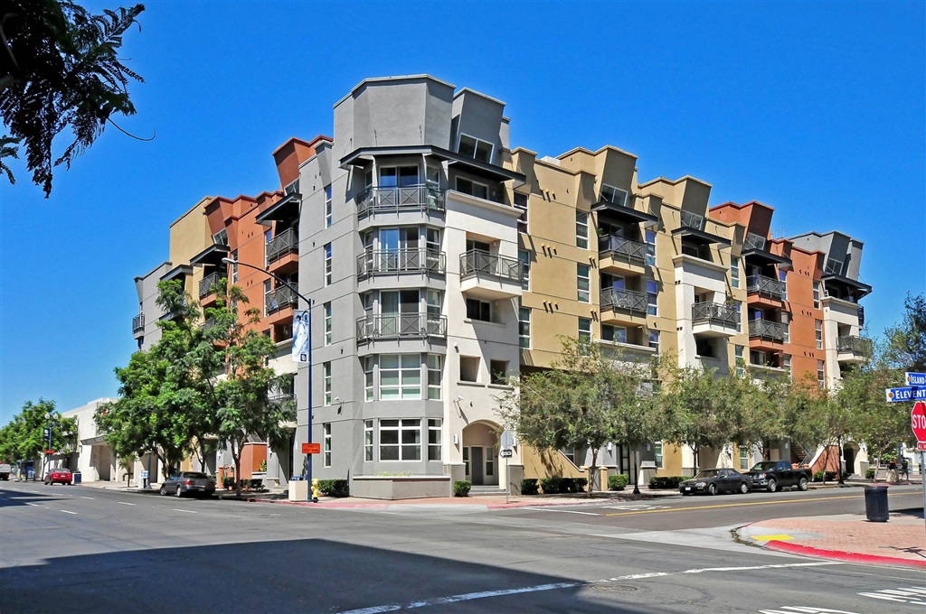Spacious top-floor East Village residence complete with split bedrooms/baths, each with their own walk-in closets, great for roommates! Boasting granite countertops in the kitchen and baths, condo also features new carpet throughout, an ambient corner fireplace and a bonus full-size washer/dryer! Take in the city skyline views from the large balcony or head up the spiral staircase to the expansive private deck for some fresh air or al fresco dining! Just two short blocks to Petco Park and freeways 5 and 163, and a short walk to the exciting Gaslamp Quarter. Secured Park Blvd West complex includes manicured courtyards and spa. 2 assigned tandem parking spaces included, available for immediate occupancy. Sorry, no pets allowed. Neighborhoods: East Village Complex Features: , View: City,Evening Lights