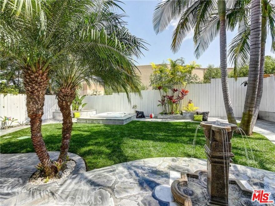 First showing available on Friday 5/9/2025. A stunning contemporary residence located in the prestigious gated community of Pines Estates in the desirable Harbor Pines neighborhood. Situated at the end of a quiet cul-de-sac, this rare two-story single-family home offers one of the most sought-after floor plans and locations in the community. As you enter, you're welcomed by soaring ceilings, abundant natural light, and brand-new flooring on the first level. The open layout features a spacious living room with a modern Fire-on-Ice fireplace, a formal dining area, and a well-appointed kitchen with a center island and breakfast nook, ideal for everyday living and entertaining. The home also features a remodeled spa-style primary bathroom, fully paid-off Tesla solar panels, a tankless water heater, an EV charger in the garage, a water softener system, and a beautifully landscaped backyard with flagstone hardscape, mature palm trees, a fountain, and a private spa for ultimate relaxation. The expansive primary suite upstairs offers a soaking tub, walk-in shower, dual vanities, and an oversized custom walk-in closet. Three additional bedrooms, a large dual-sink bathroom, and a spacious laundry room with built-in cabinetry complete the second floor. A low HOA fee includes water and landscaping, offering both value and convenience in this exceptional home.
