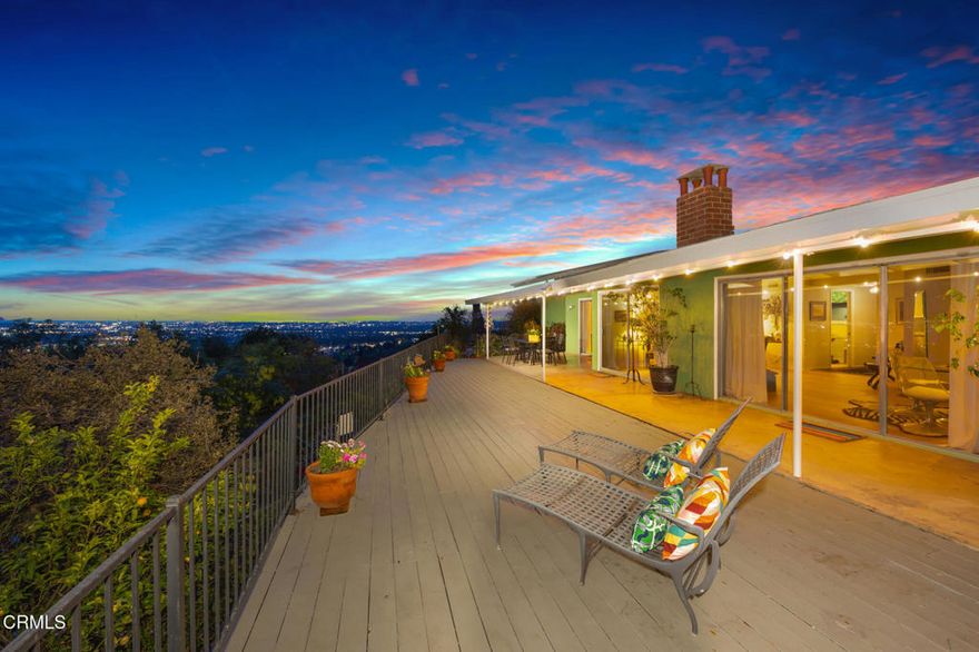 Meander to the top of the world just before the end of a quiet road you'll find this vintage Mid-Century Ranch home boasting breathtaking, panoramic valley and mountain views from every room. If you crave privacy and a slower-paced lifestyle, look no further, this property offers a rare and exceptional opportunity. For hiking enthusiasts, the home is just steps from Mount Wilson Trailhead, making nature's beauty an extension of your backyard. Step through a flagstone entrance & immediately discover the 'wow factor'.  An inviting atmosphere, where an open concept design is centered around a striking two-sided fireplace. Floor-to-ceiling windows in the living & dining and sitting area seamlessly blend indoor & outdoor spaces, drawing you in with mesmerizing views that invite you to stay awhile.  A cozy sitting nook, lined with 2 walls of shelving, is perfect for showcasing family treasures. Sliding glass doors in the living & dining rooms and the primary bedroom open to an expansive viewing deck, an ideal setting for intimate dinners or entertaining on a grander scale, all while basking in the beauty of nature that surrounds you. A thoughtfully designed floor plan features the public rooms on the west with the guest bathroom and private rooms on the east side of the home. The backyard provides space for a garden or pets, and the property is also adorned with a pomegranate and lemon tree. A roomy shed awaits your creativity, perfect as a fun 'She Shed'! Recent updates include fresh interior paint, new flooring, window coverings, and new refrigerator, washer & dryer and updated sprinklers. Don't miss your opportunity to enjoy daily peace and tranquility, you are just one offer away...