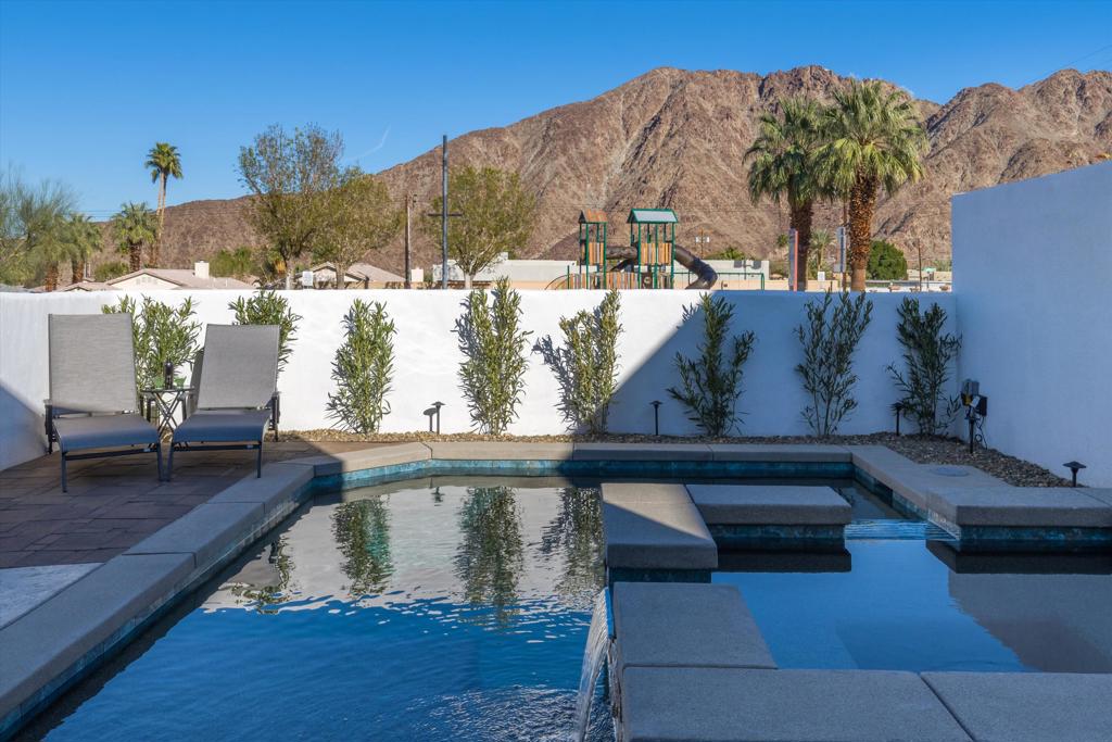 LONG TERM RENTAL. This beautiful remodeled home in La Quinta is offered turnkey furnished. Enjoy stunning mountain views from your private walled yard, complete with a saltwater Pebble Tec pool and spa newly built. Perfect for entertaining, the spacious, open-concept living area seamlessly connects the gourmet kitchen (featuring stainless steel appliances and elegant quartz countertops) to the dining and living area. The luxurious primary suite offers a tranquil retreat with its own en-suite bathroom boasting dual sinks, a rejuvenating shower, and a soothing bathtub. Step out onto your private patio through sliding glass doors. Two additional generously sized bedrooms share a well-appointed bathroom with a shower/tub combination, ensuring comfortable living for everyone. A separate laundry area and a two-car garage add further convenience.Beyond the home's comfort, its prime location offers unparalleled access to the vibrant energy of the Coachella Valley. Enjoy a quick 10-minute drive to Coachella and Stagecoach festivals, as well as other exciting events. Old Town La Quinta, with its charming shops and restaurants, is a mere 5 minutes away.All adult applicants should participate in credit back ground check including criminal and eviction checks. Ideal candidates will possess good credit, a verifiable rental history and a verifiable monthly income at least 2.5 times the monthly rent. Bankruptcies and prior evictions are not permissible. Renter's insurance is required prior to move-in, and tenants are responsible for all utilities. Owner pays for pool service.Contact Ana Cisneros at (760) 641-7226 to schedule a viewing.