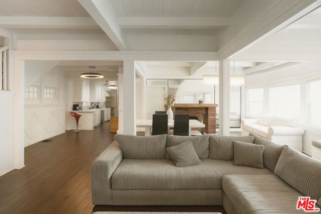 MASSIVE PRICE REDUCTION: Venice Beach Investment Opportunity with Ocean Views and Rooftop Deck. NOW $500,000 LESS. MOTIVATED SELLER CREATES UNPRECEDENTED VALUE. This 1910 Venice Craftsman, expanded in the 1990s, delivers approximately 3,396 sq. ft. of flexible space with 5 bedrooms and 4 bathrooms, including two separate-entry apartment-style suites. The strategic layout supports multiple configurations perfect for owner-users, investors, or maximizing short-term rental potential in one of LA's hottest beach communities. With this substantial price reduction, the income potential just became exceptional. Enjoy ocean views from both primary bedrooms and the incredible rooftop deck with 360-degree views of the Pacific, mountains, and city skyline. Located on the corner of 30th and Speedway, just one row off Oceanfront Walk, you're steps from the Venice Pier, Boardwalk, and premier dining and shopping. The property includes a 2-car garage plus an additional 1-car garage. Rare and valuable parking in this coveted location. The motivated seller's situation creates a $500,000 advantage that transforms the investment equation. This is Venice Beach value creation at its finest.
