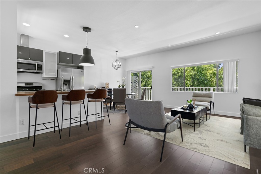 ****AMAZING OPPORTUNITY ****in the heart of Sherman Oaks! This 2 bedroom & 2 bathroom condo boasts an open concept living room with engineered hardwood floors from the livingroom to the bedrooms and 4k recessed lighting throughout. Plenty of natural light within the unit. The updated kitchen features butcher block countertops/bar, modern cabinets and stainless steel sink and appliances (refrigerator,stove,dishwasher). Stackable washer and dryer tucked discreetly inside a hallway closet for added convenience. Master bedroom has a large closet & full updated bathroom. Second bedroom has ample space and full size updated bathroom across the hallway. The unit is located at the rear of the building and is super quiet and peaceful. Central A/C and heater operated by NEST. Two subterranean parking spaces. Community amenities include, fitness center, additional laundry room, billiard table and recreation room. Minutes from the shops,restaraunts & bars on Ventura Blvd. 2 minute walk to Whole Foods & Hugo's Tacos, a neighborhood favorite.