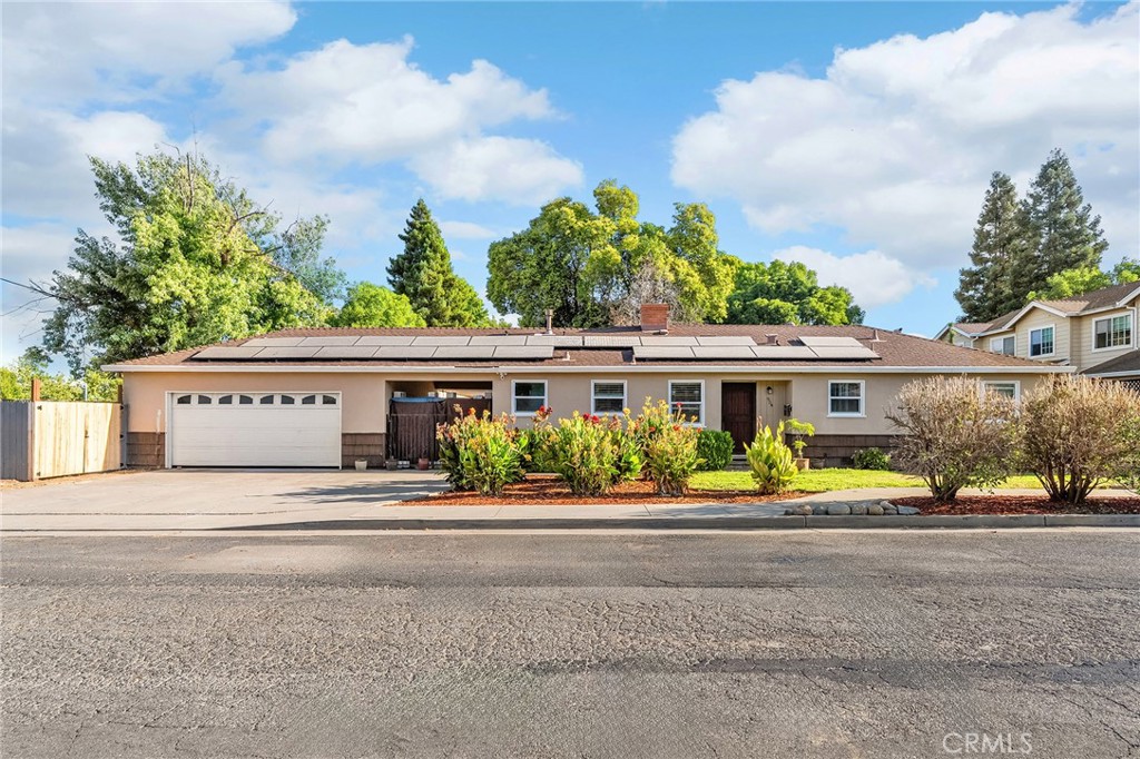 Welcome to 954 Myrtle Avenue, where charm, flexibility, and outdoor living come together on a spacious corner lot. This 3-bedroom, 2-bathroom home offers a timeless layout. Step inside to discover beautiful hardwood floors, a cozy wood-burning stove, & a large bay window that fills the living room with natural light. The dining space flows seamlessly within the living room, creating a warm and inviting atmosphere that's perfect for hosting gatherings or enjoying everyday moments. The kitchen is situated just off the entryway, thoughtfully designed with tile floors, laminate counters, recessed lighting, stainless steel appliances, including a gas range & over-the-range microwave. Whether you're meal-prepping for the week or entertaining guests, the kitchen's proximity to the main living area keeps everything within reach. Down the hallway, you'll find the 3 bedrooms & the main hall bathroom, creating a private wing tucked away from the living spaces. Tucked off the kitchen is a convenient 3/4 bathroom and cabinet pantry area, with direct access to a covered breezeway that connects the home to the detached two-car garage. Under the breezeway, you'll find the laundry area with both gas and electric hookups, perfectly placed for easy access without sacrificing interior space. But the real bonus? Attached to the back of the garage is an incredible flex space. With updated LVP flooring, vaulted wood-beamed ceilings, and a mini-split system for year-round comfort, this space is a blank canvas. Whether you envision a home gym, game room, home office, workshop, or all of the above, this versatile area is ready to adapt to your needs. Outside, the oversized backyard wraps around the bonus space and is filled with potential. A large concrete patio provides plenty of room for BBQs and seating, & there's still ample space to add garden beds, a fire pit, play area, pool, or anything else you can dream up. With a solar system supporting energy efficiency, a whole-house fan to keep things cool, and mature trees adding natural shade and beauty, this home blends practicality with lasting charm. While freeway access is just minutes away from easy commuting, the property is also located near a wide variety of everyday conveniences, from grocery stores to the movie theatre & more. 954 Myrtle Avenue isn't just a home, it's a lifestyle property offering flexibility, space, & comfort in one of Chico's most convenient locations. Don't miss the opportunity to make it your own!